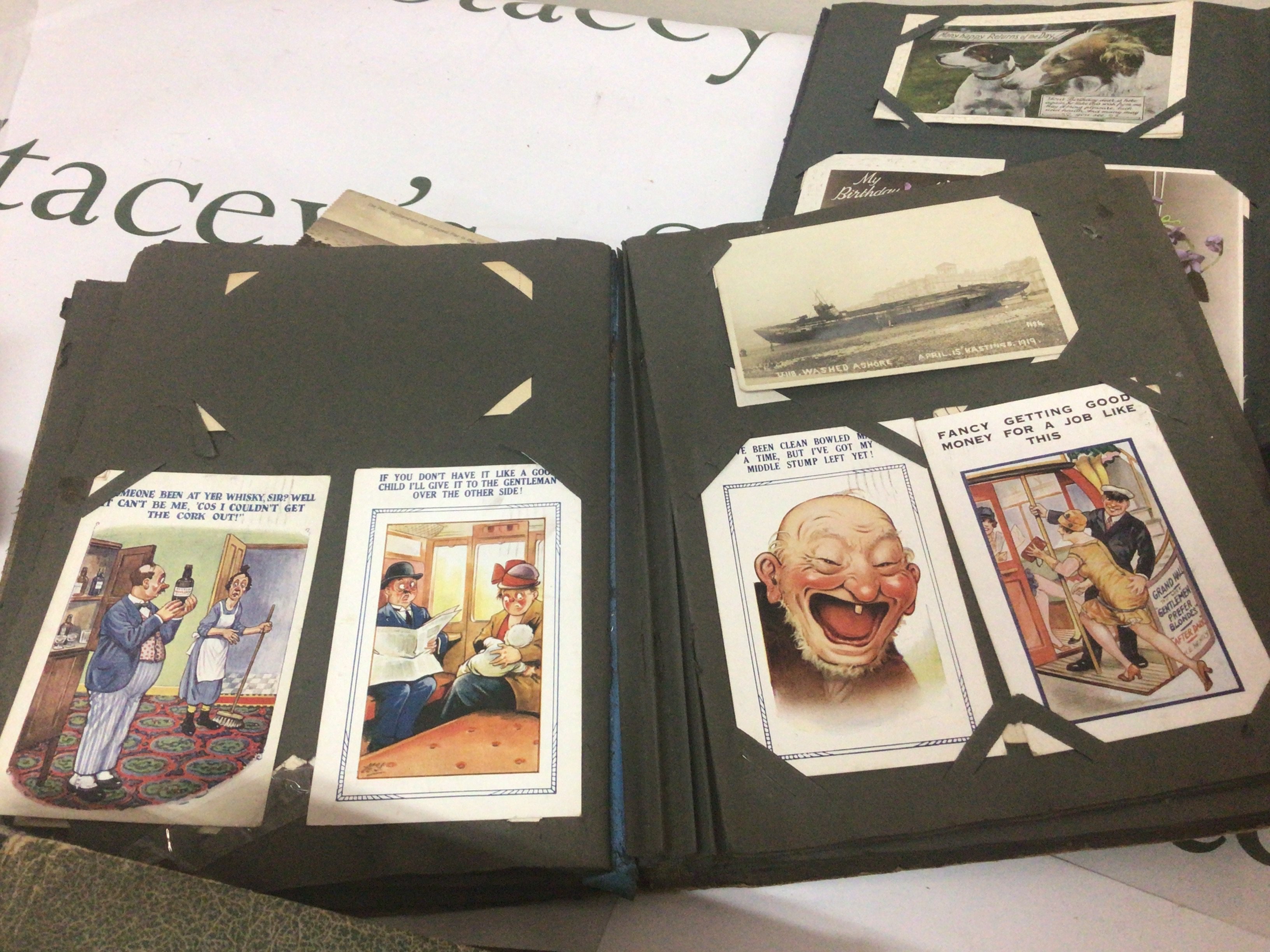 Four albums containing early 20th century British postcards including an interesting collection of early comical cards (4)