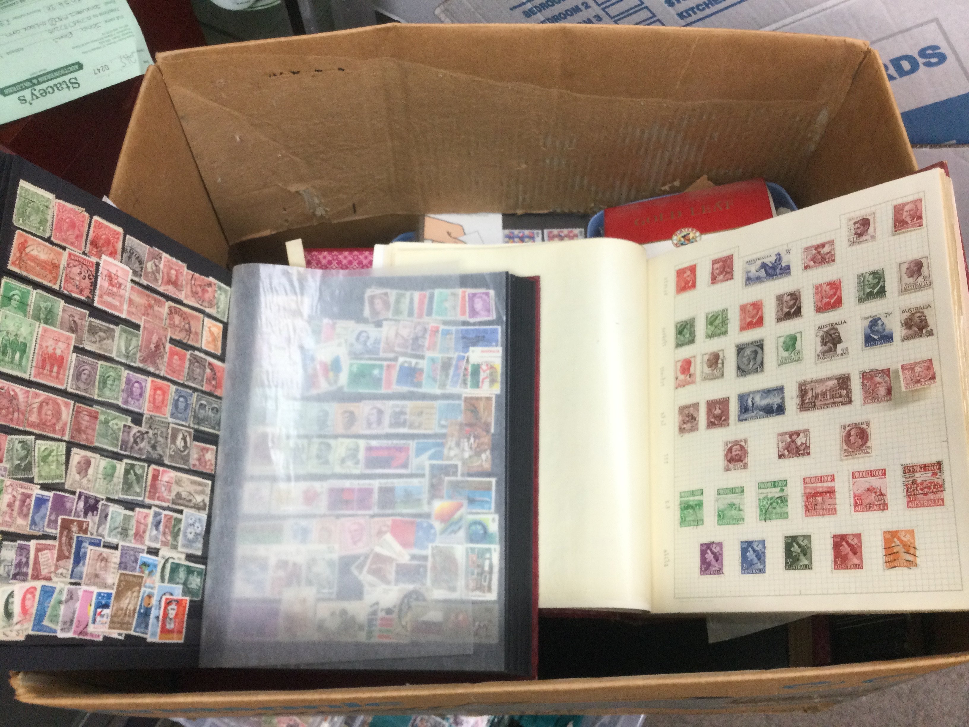 A box of mixed world stamps, loose and in binders. Shipping category D.
