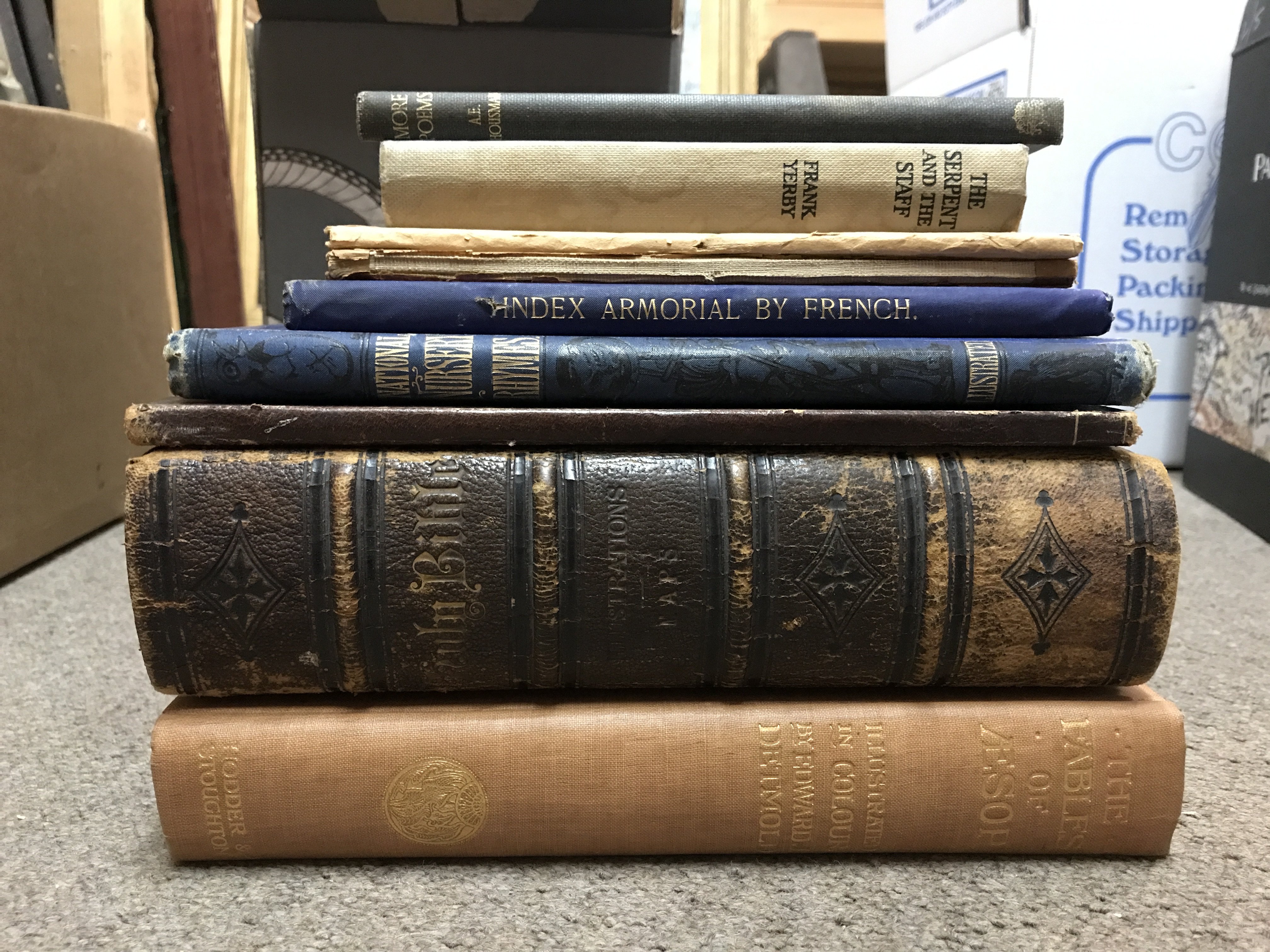 Collection of books including more poems by A.E HOUSMAN Jonathan cape, The Serpent and the staff by Frank Yerby 1958, Scottish Highlands and The Wye water colours by Sutton Palmer, Index Armorial by French number 171 of 200, National Nursery Rhymes set to original music by J.W. ELLIOTT George Routledge and sons, Holy Trinity Church 1882 memorial window to the Kate Rev Peter French, 19th century leather bound bible , The Fables of Aesop illustrated by Edward J Dermold Hodded and Stroughton. Postage category C