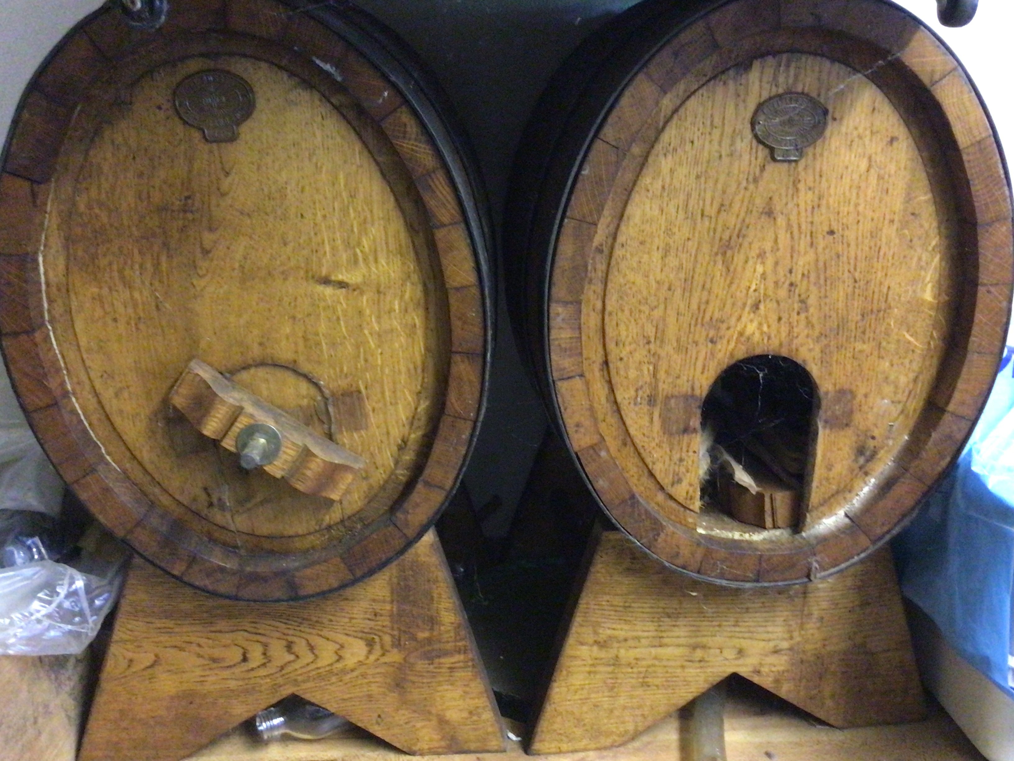 Two Vintage 50L oak wine caskets on stands (2)
