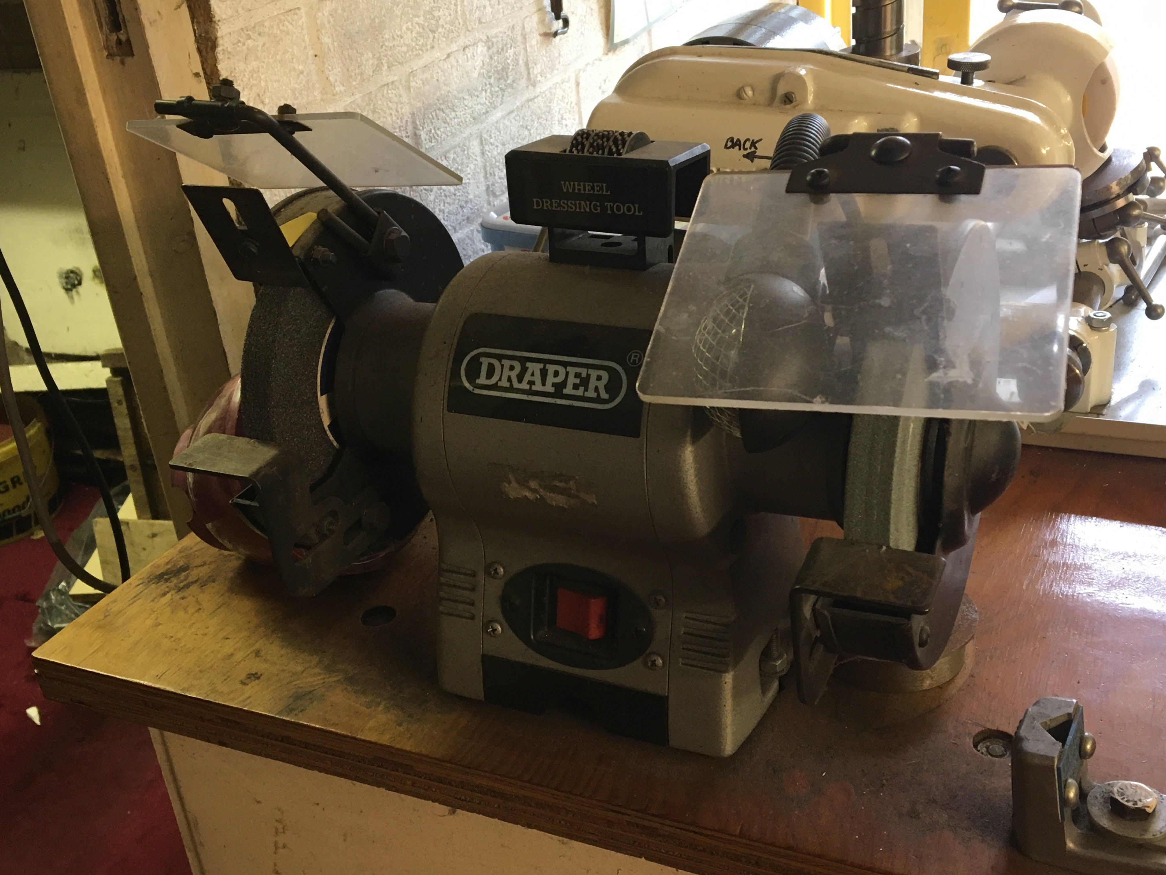 A Draper bench top double grinder seen working and only lightly used, Viewing by appointment sold in situ buyer to collect RM15 South Ockendon.