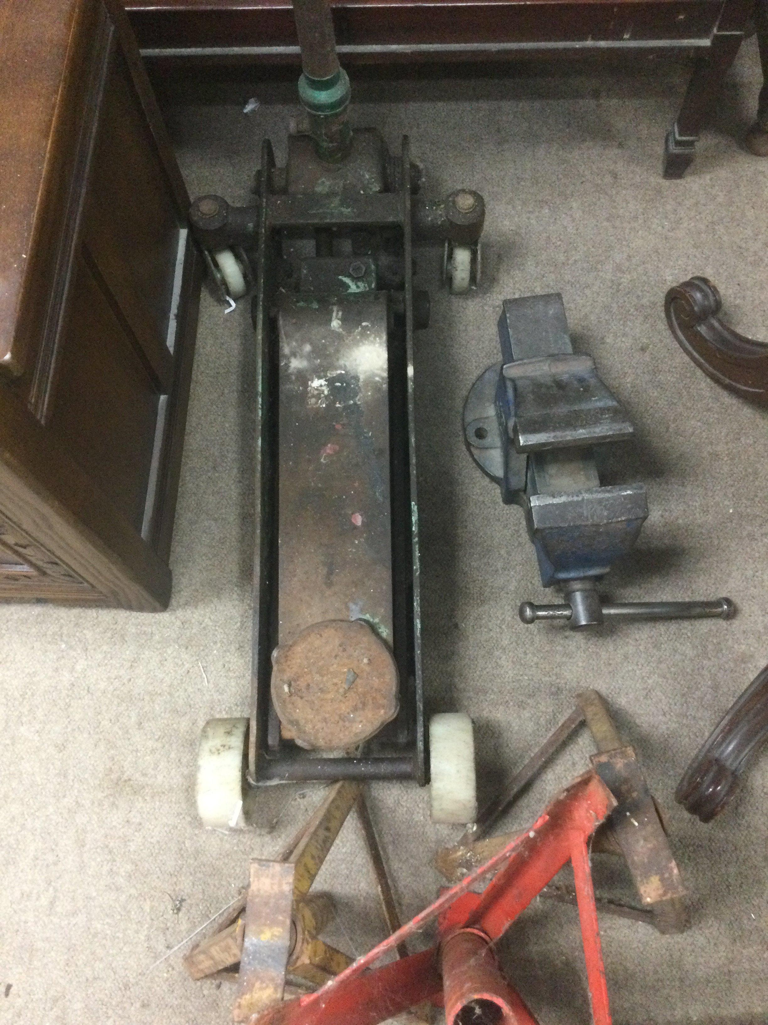 A car jack trolley and a vice . No Reserve.