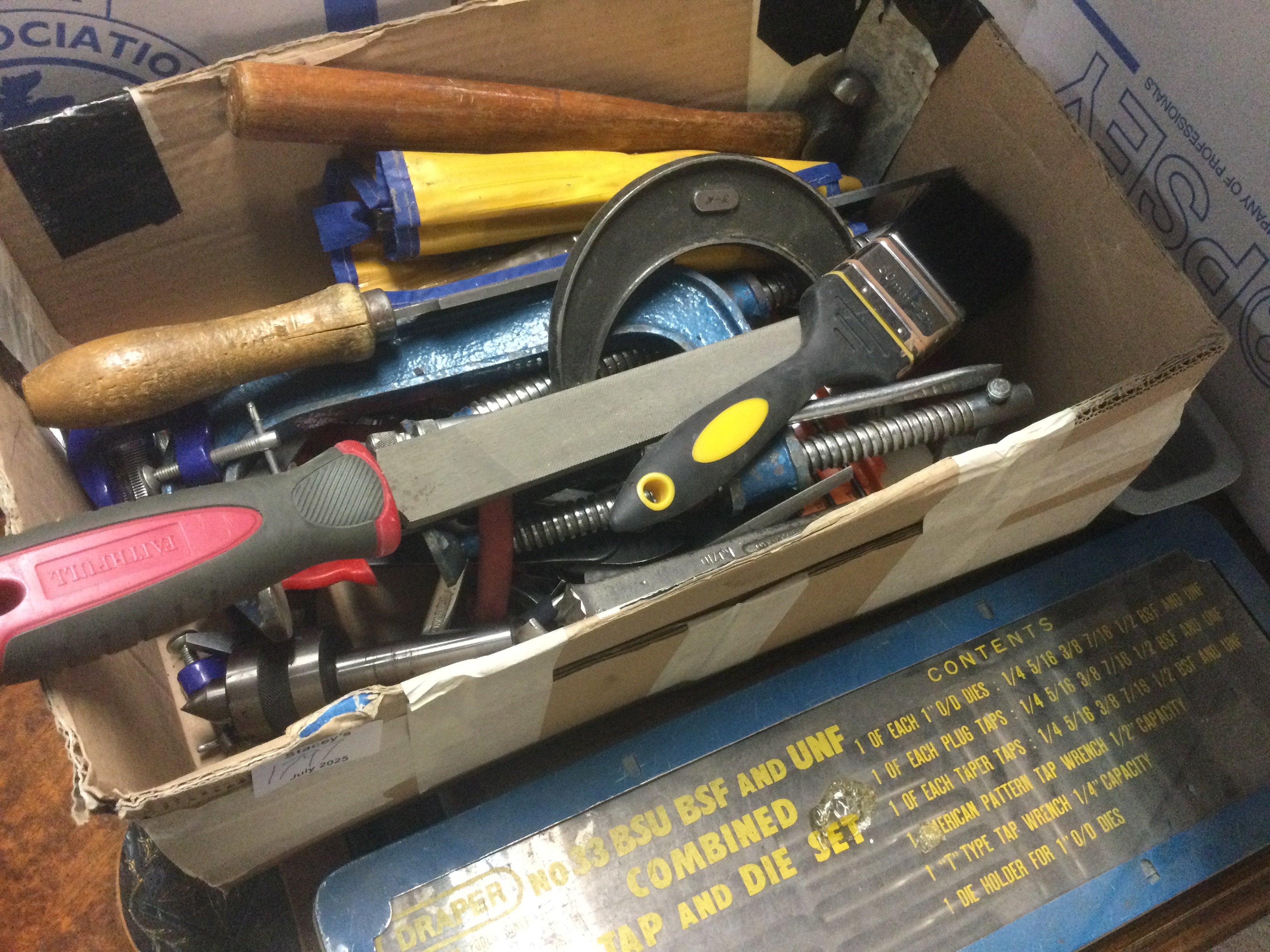 Two boxes of tools various and a proxxon drill .