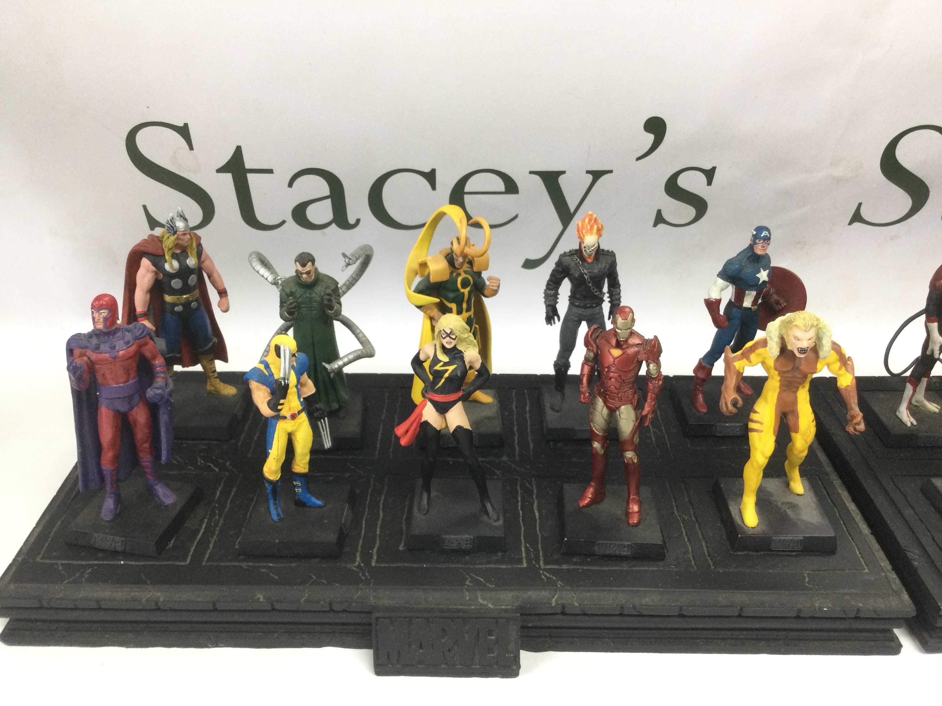 A collection of approx 60 Marvel action figures with display stands. Shipping category D.