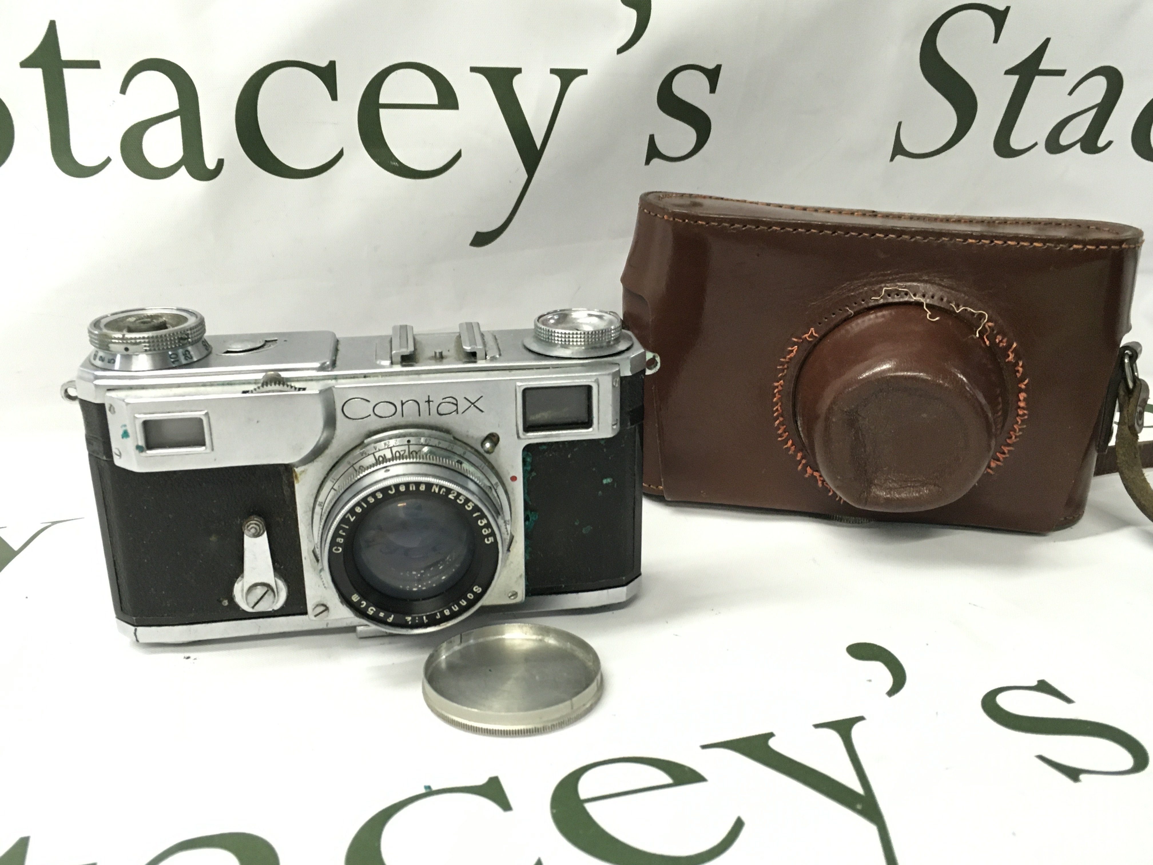 A Vintage Contax Zeiss Ikon camera with leather case . Postage category B