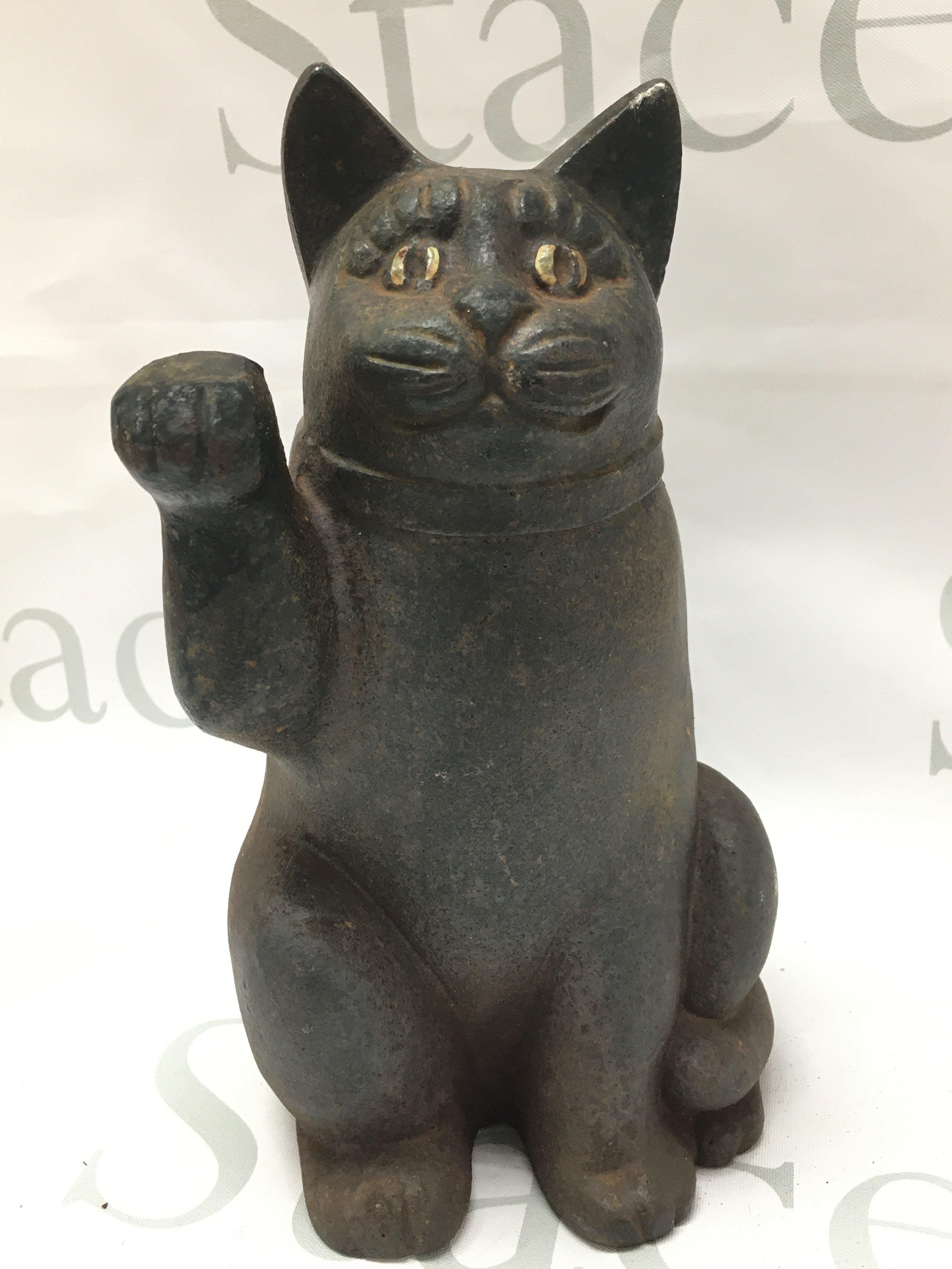 A vintage cast iron Maneki-Neko cat, 22cm tall. Postage category B