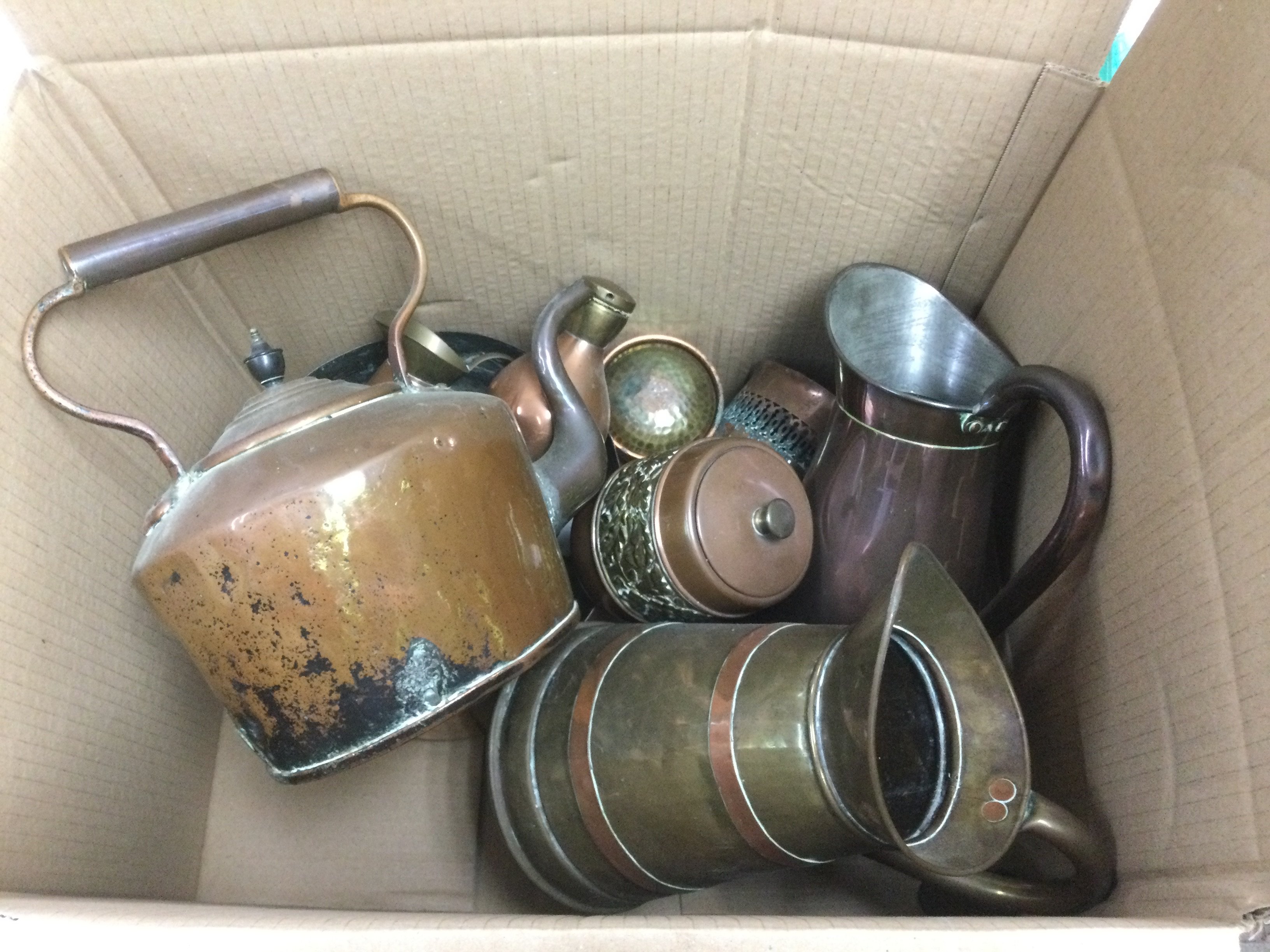 A box of Victorian and later copper and brass items comprising cooking pans, jugs etc. Shipping category D.