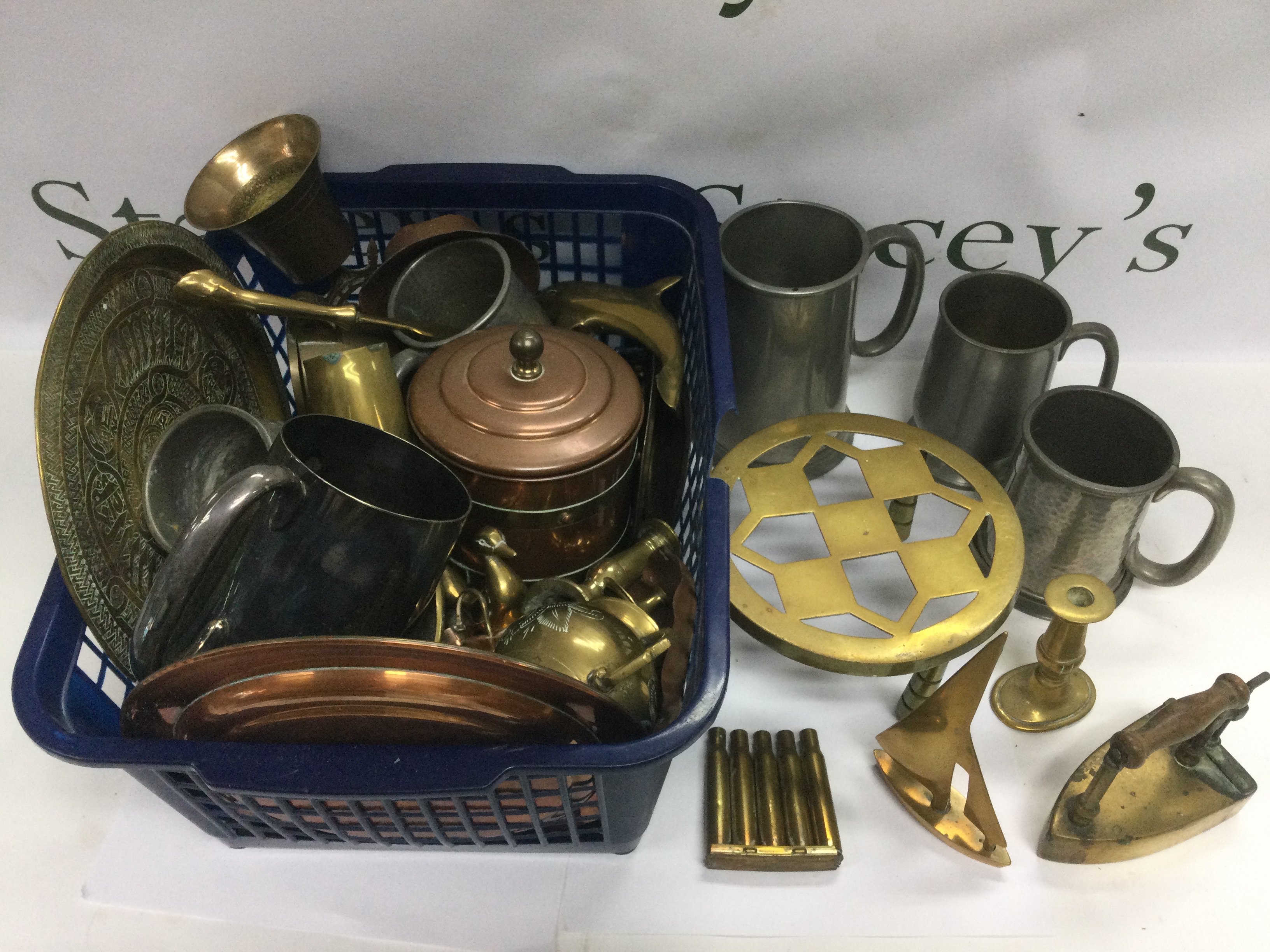 A collection of copper, brass and metalware comprising tankards, ornaments etc. shipping category D.