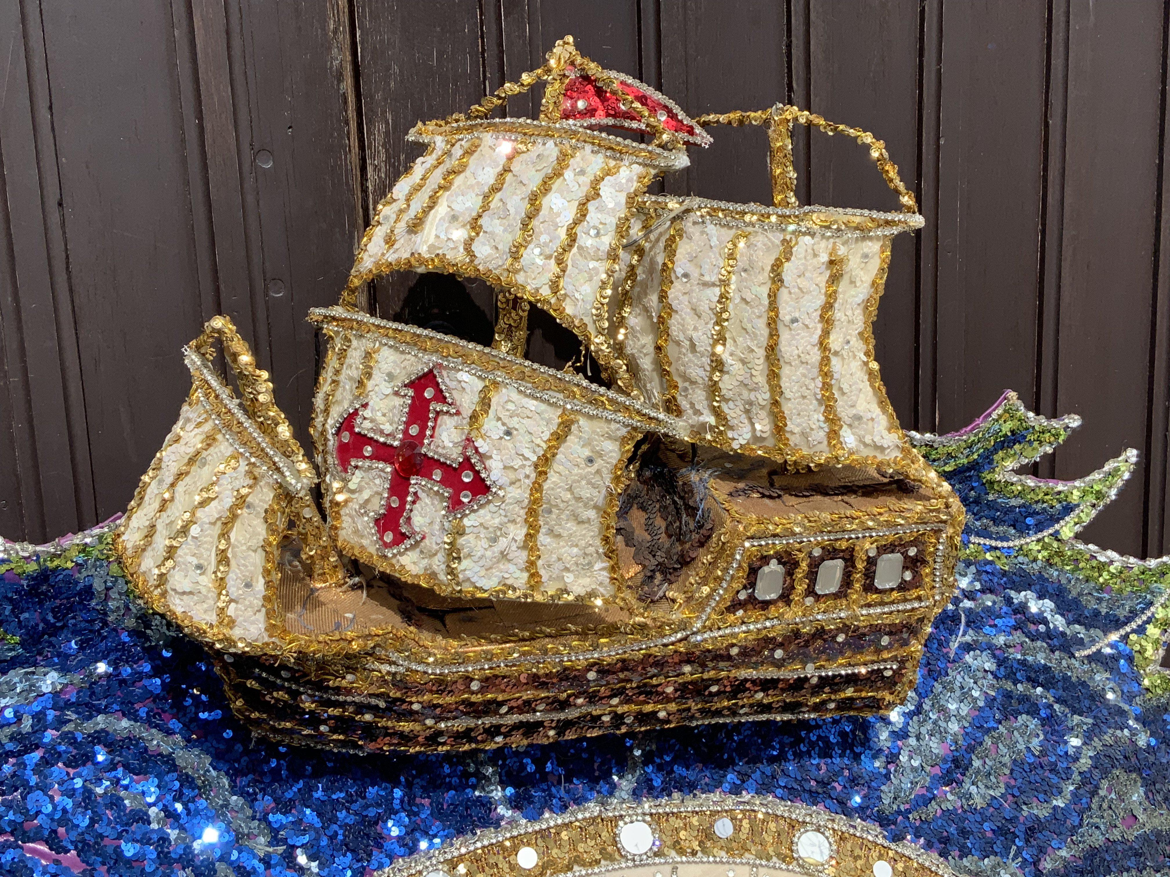 An elaborate Mardi Gras costume the theme of the three Christopher Columbus galleons Santa Maria, Nina and The Pinta, worn and made for the New Orleans Mardi Gras Circa 2010, Purchased at Vicky Vines Auction, Houston Texas. Wire framed and sequin covered. (A)