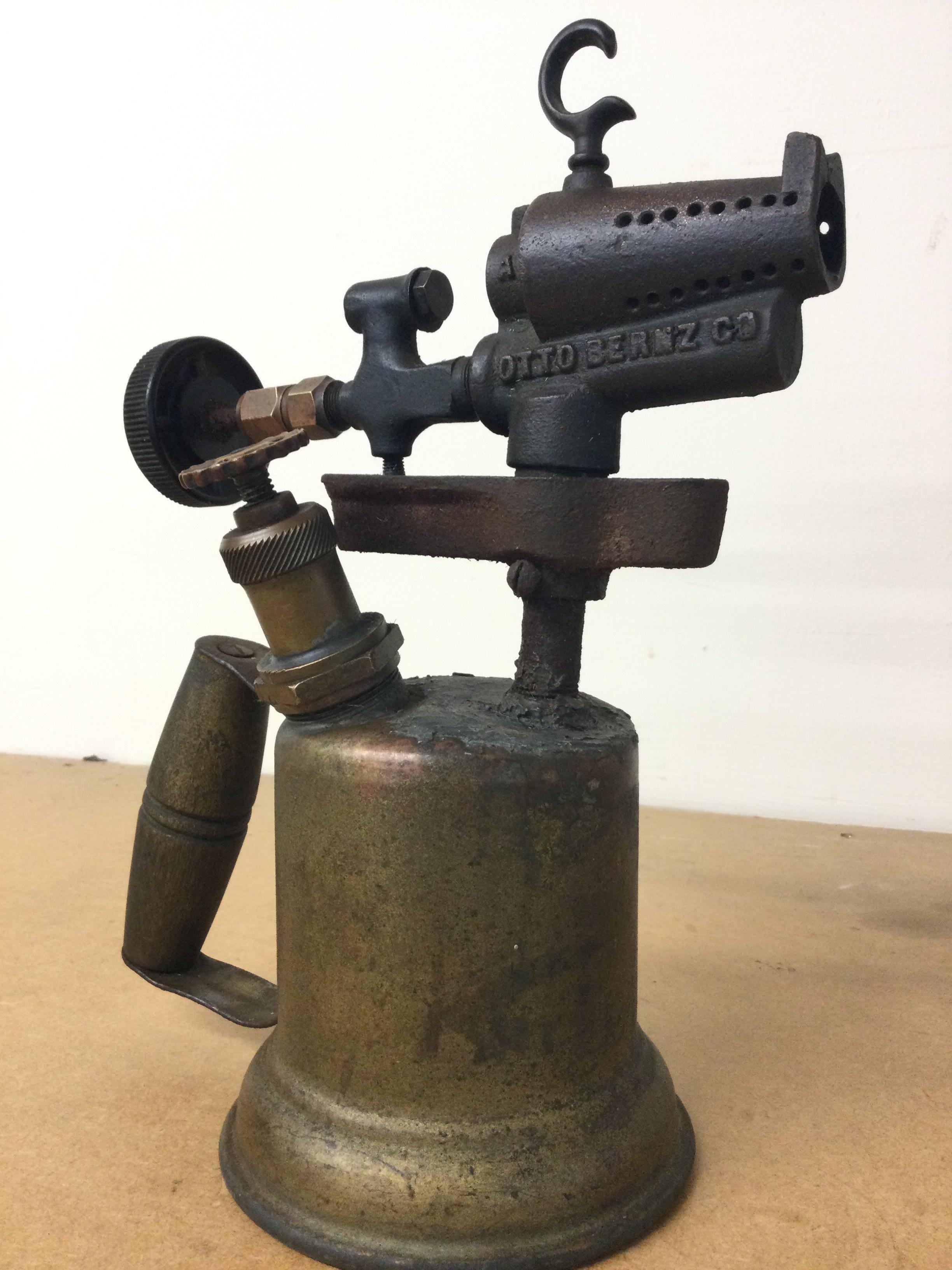 A very early blow lamp , 27cm tall postage cat B