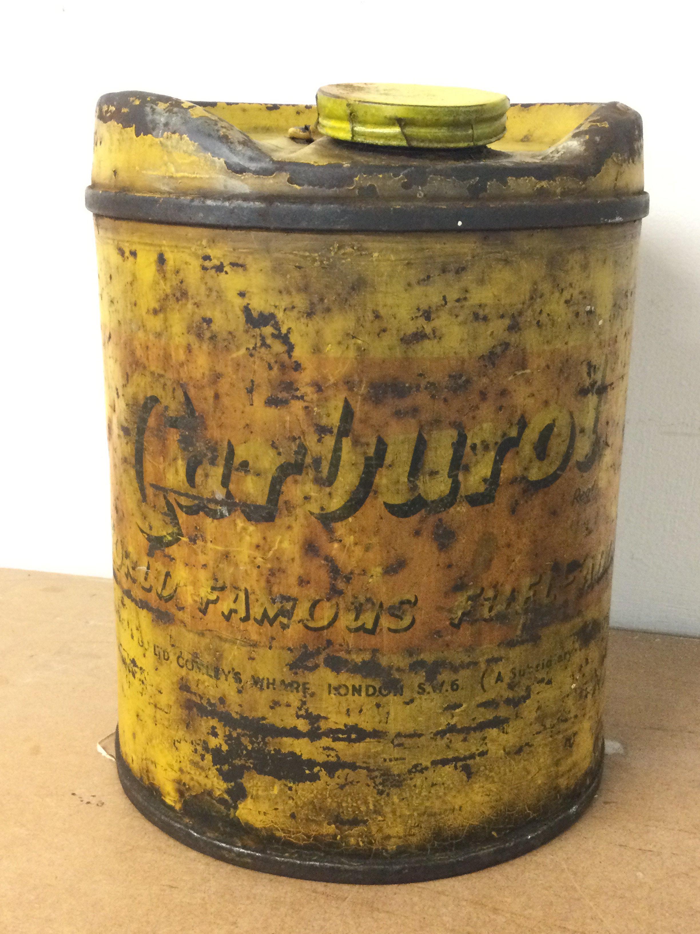 A rare early Carburol round tin, 24cm tall. Postage cat c