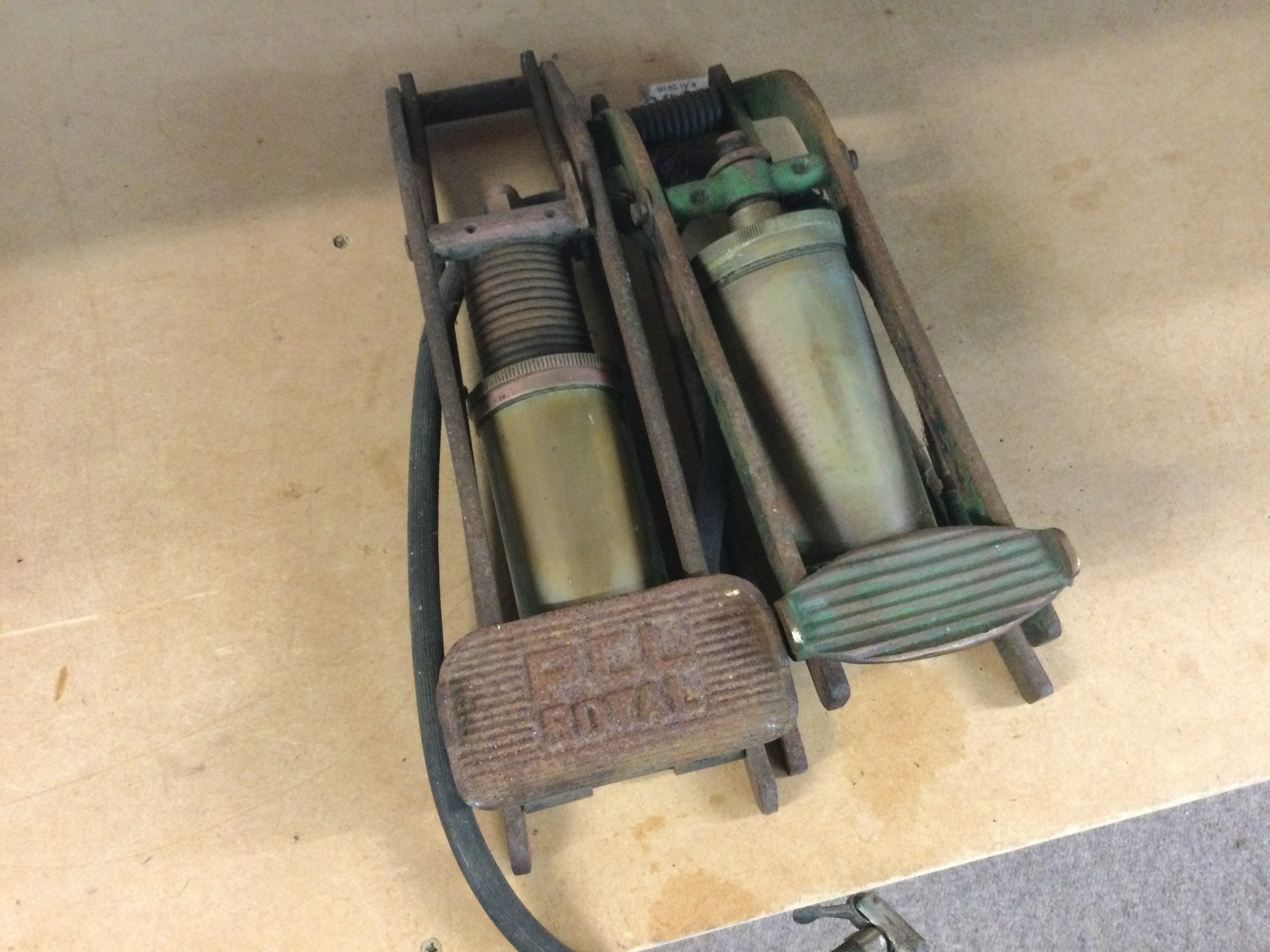 Two vintage car tyre pumps , postage category B