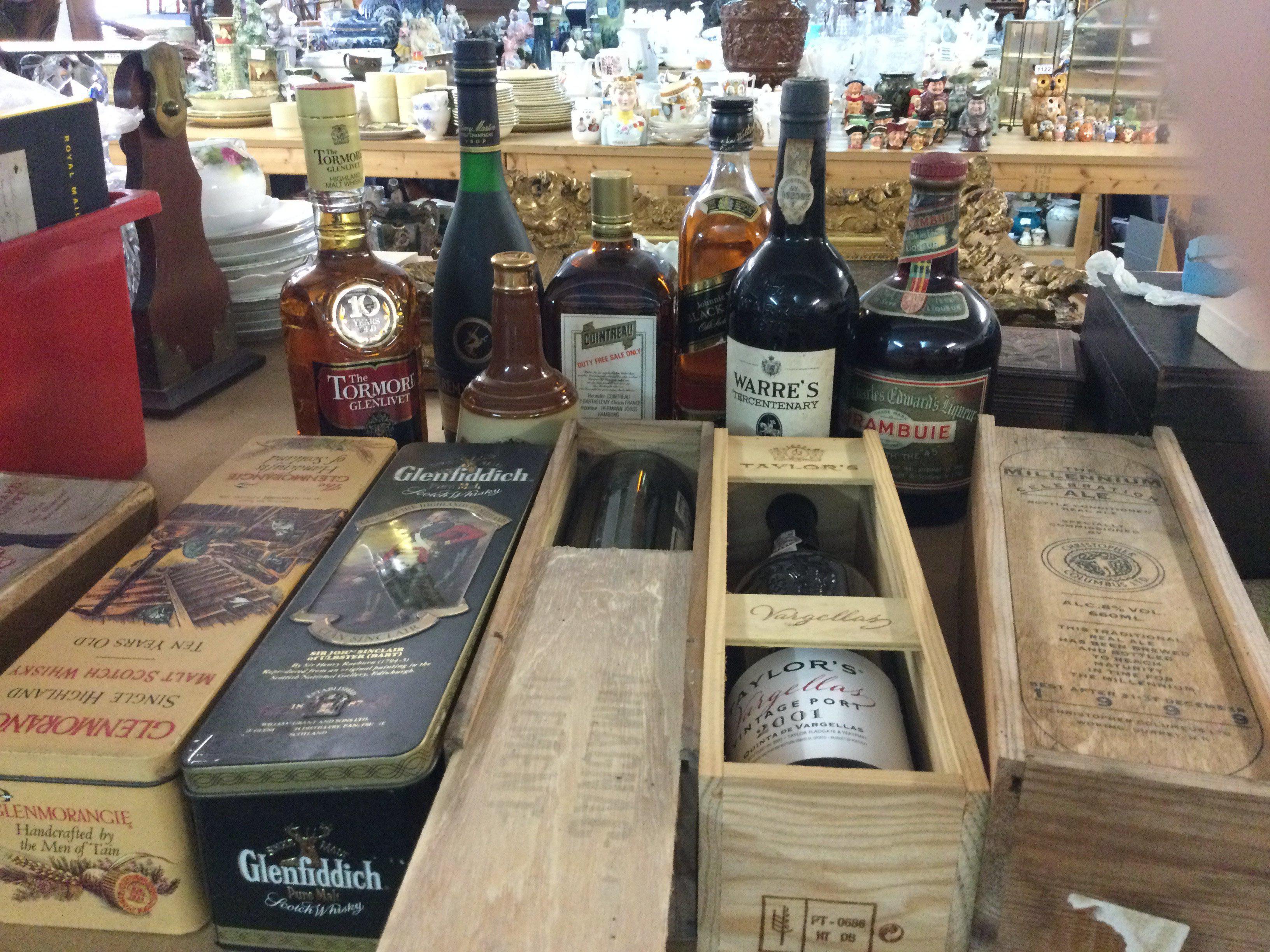 Twelve bottles of alcohol including Whisky and Port