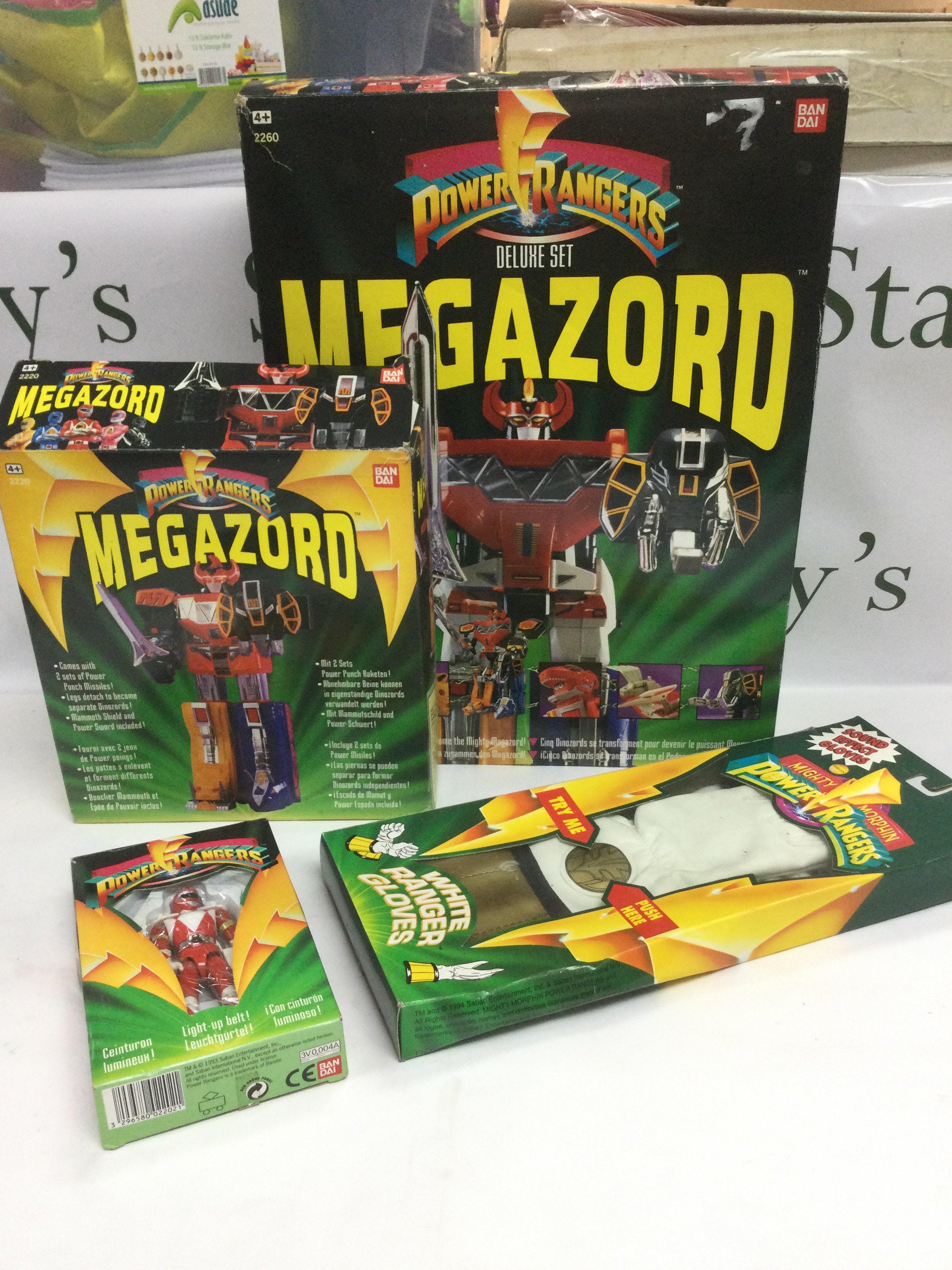 Four boxed Power Rangers toys, Megazord incomplete. Shipping category B.