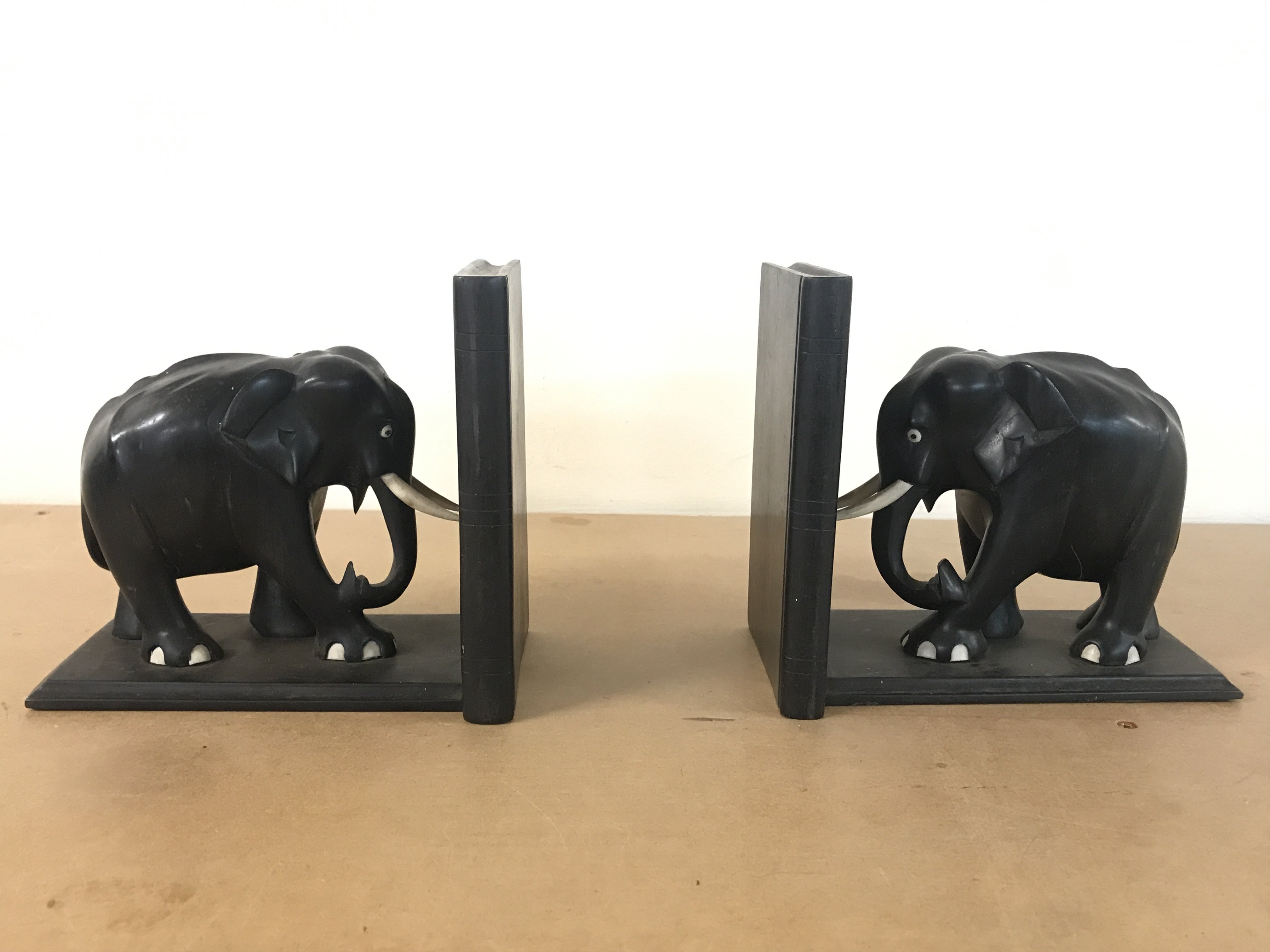 Ebony elephant bookends. 17.5cm tall 19cm wide. Postage category B
