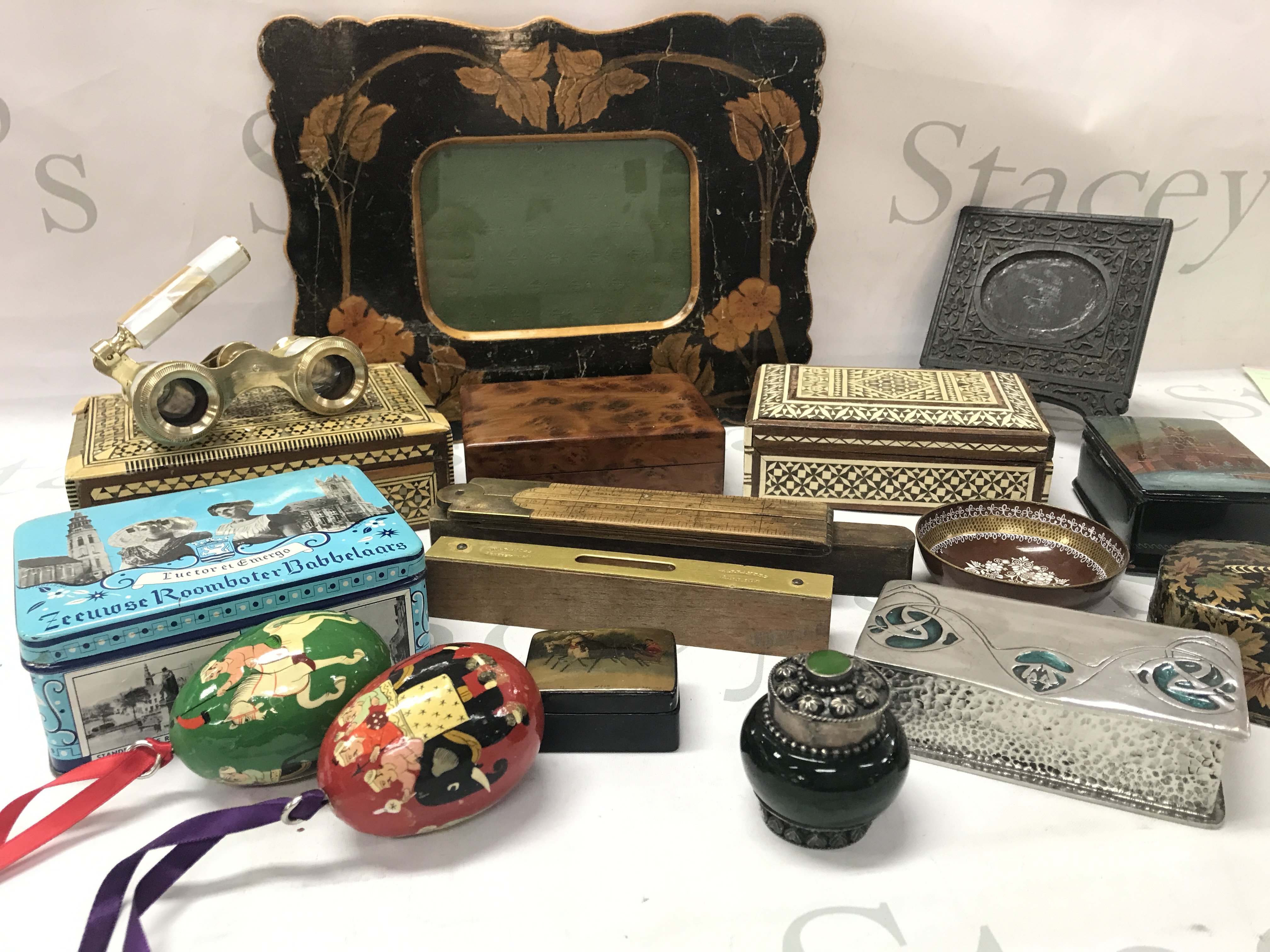 A group of interesting items including hans painted boxes, Russian box, Pearl opera glasses, arts and crafts style box