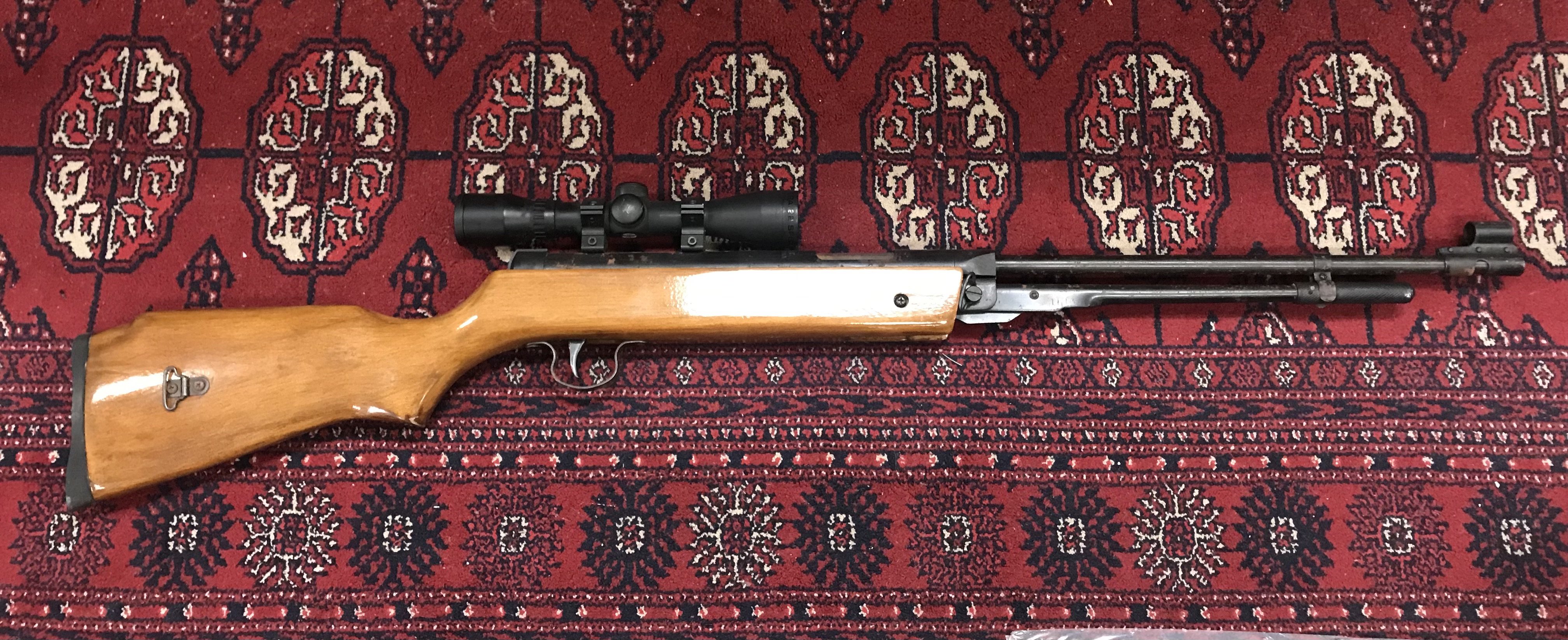 Vintage air rifle with a BSA .22 Scope, 103cm long. Mechanism seen functioning. This lot cannot be posted