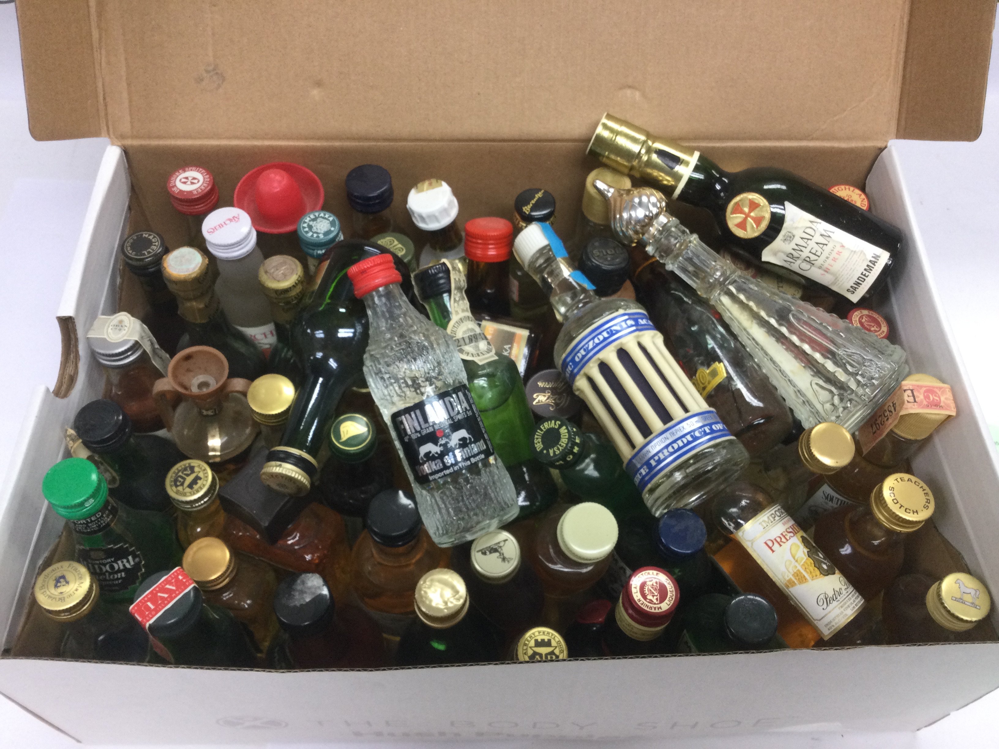 A collection of miniature bottles of alcohol. Shipping category D.