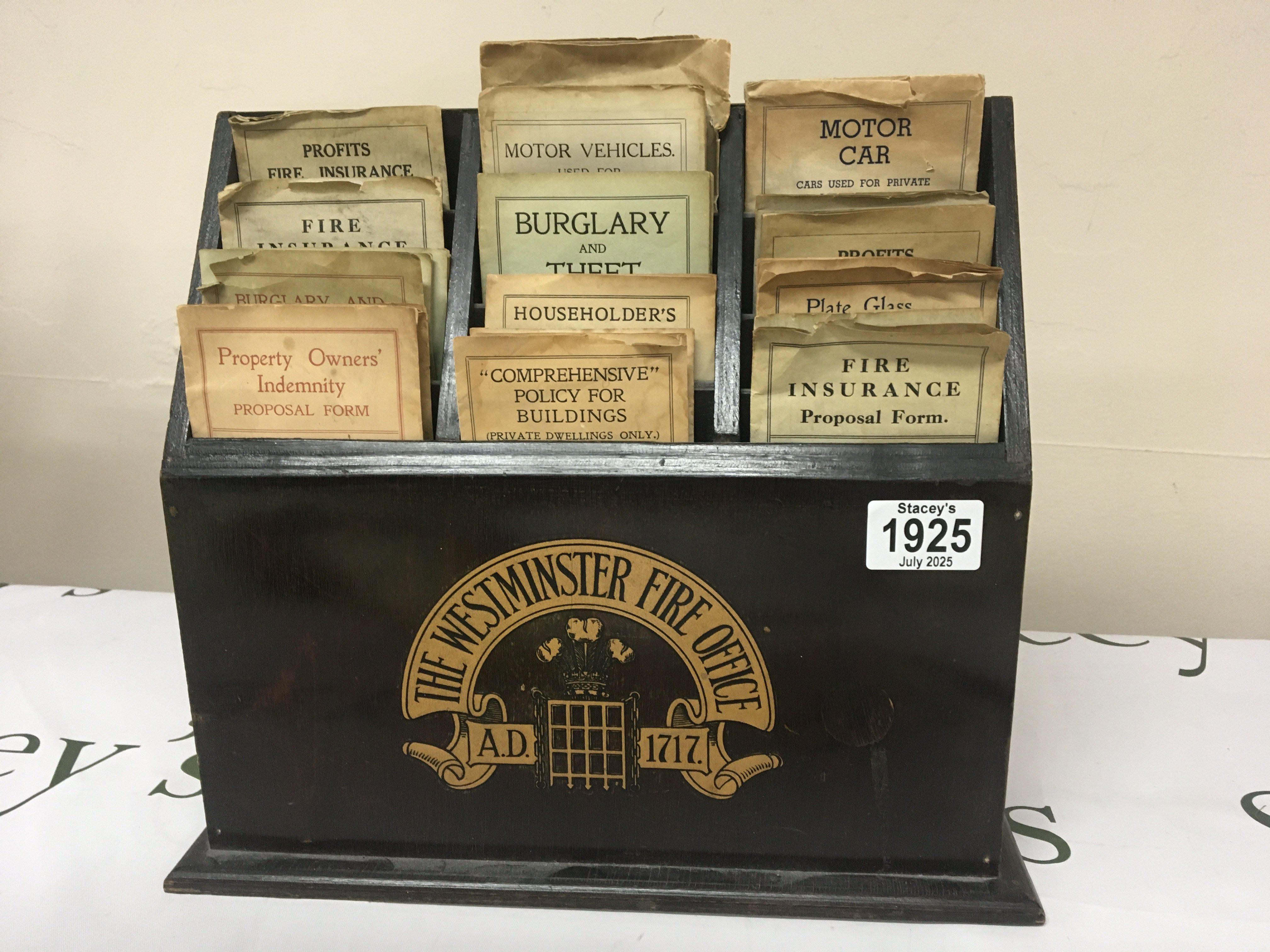 A Vintage The Westminster Fire Office leaflet box display Insurance and Indemnity policys.