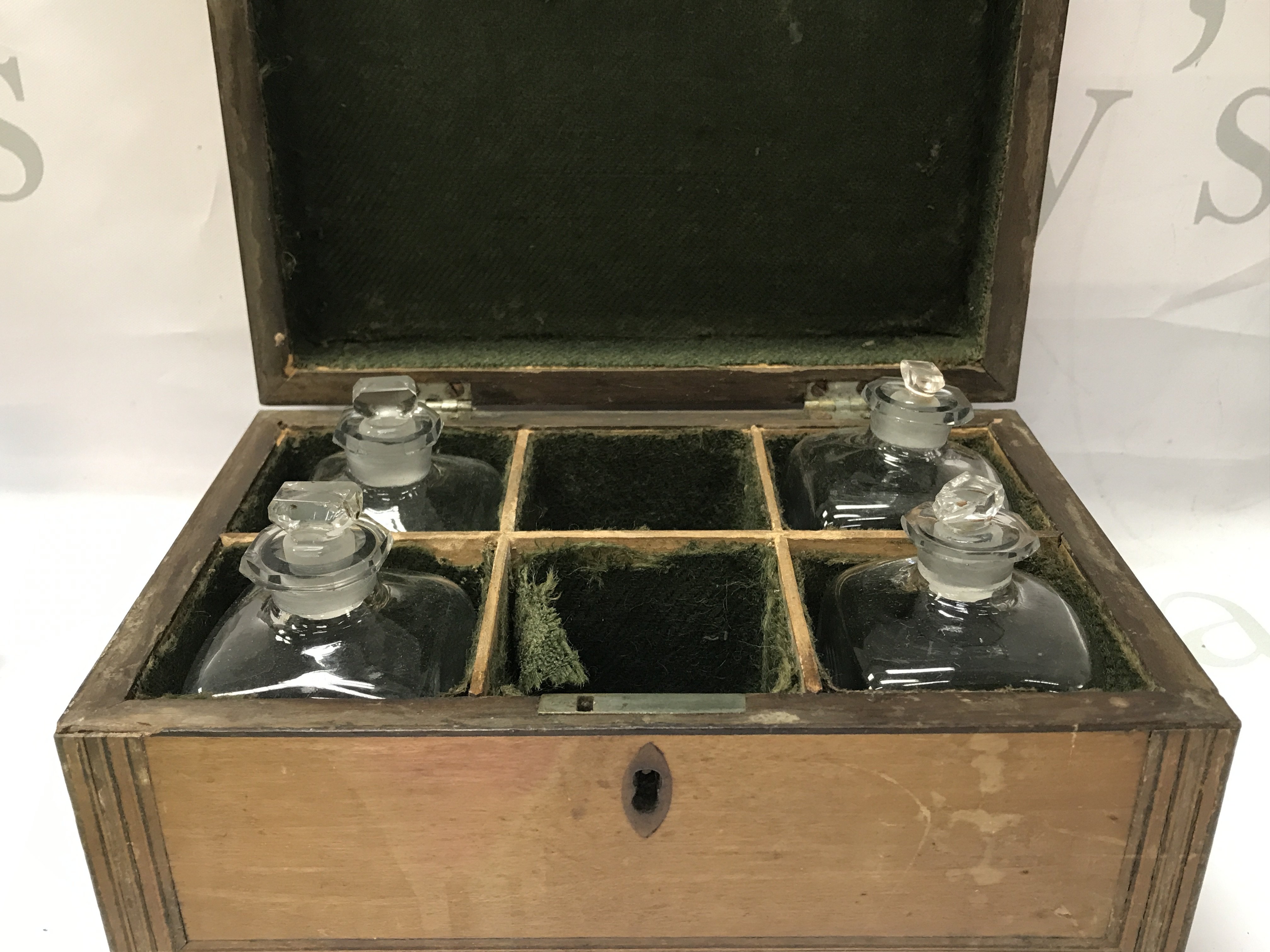 A box with glass bottles dimensions length 14cm x width 21cm x height 10cm . This lot cannot be posted