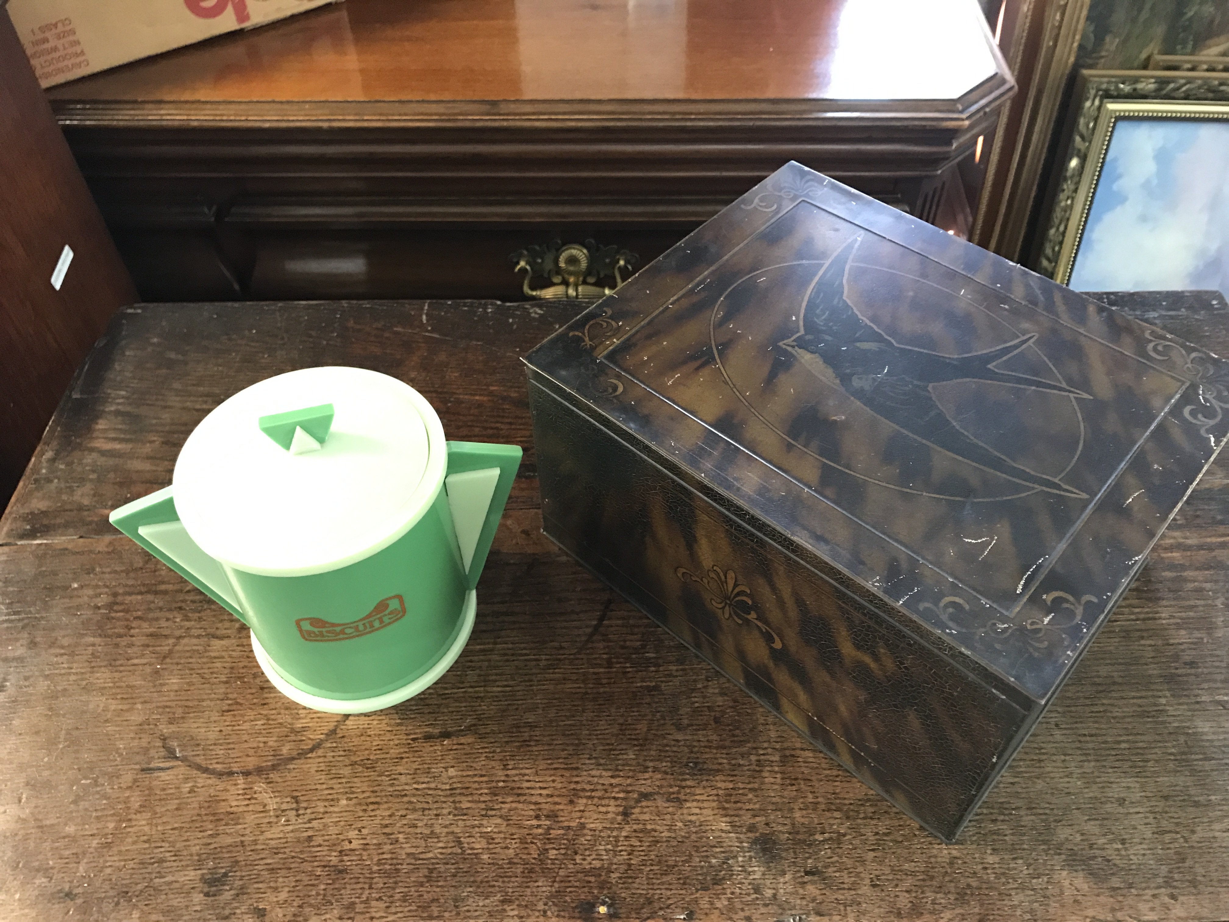 A blue bird tin and an art deco plastic jar. Postage category C