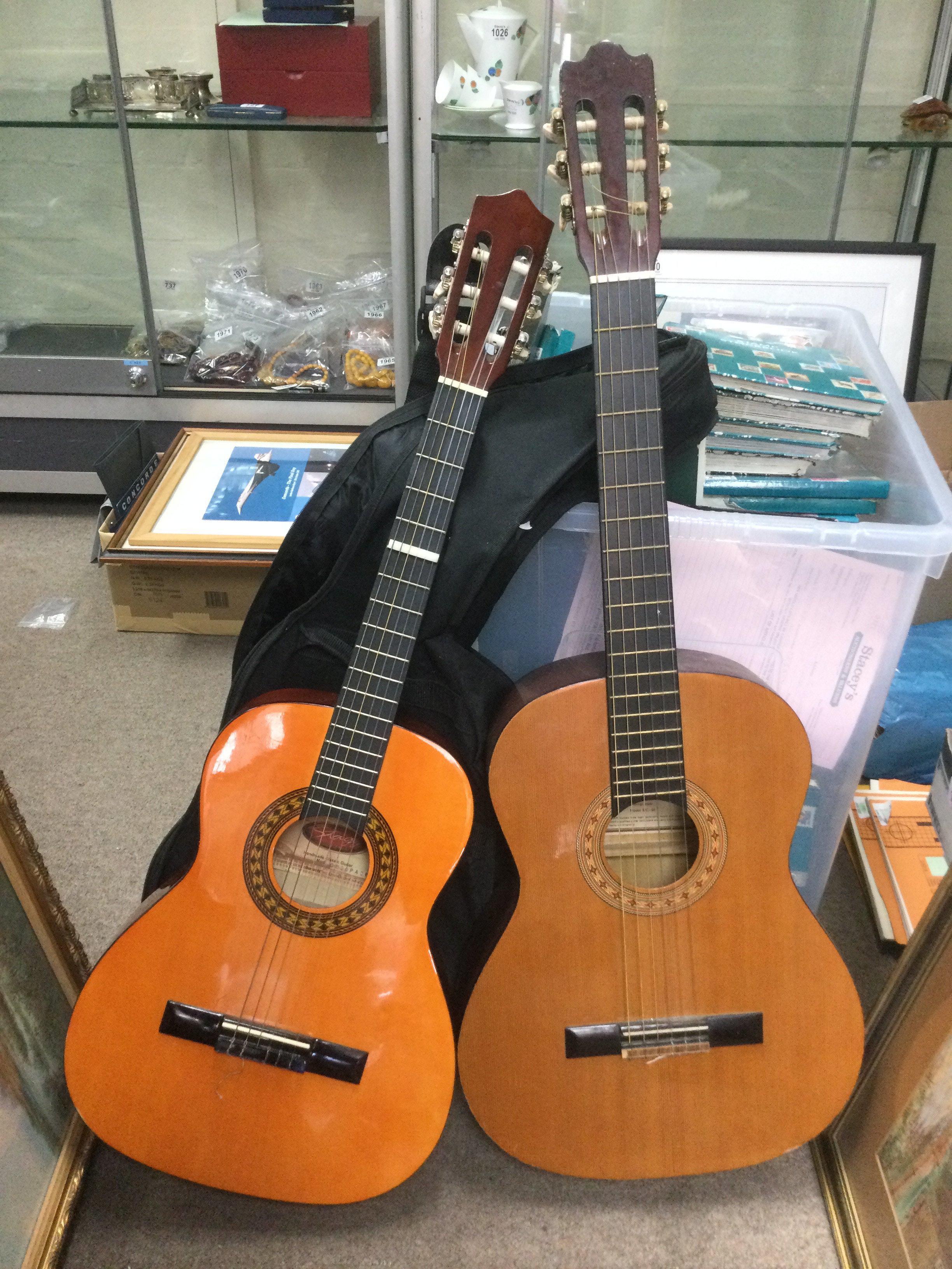 Two classical guitars comprising a Hohner and a Stagg. Shipping category D.