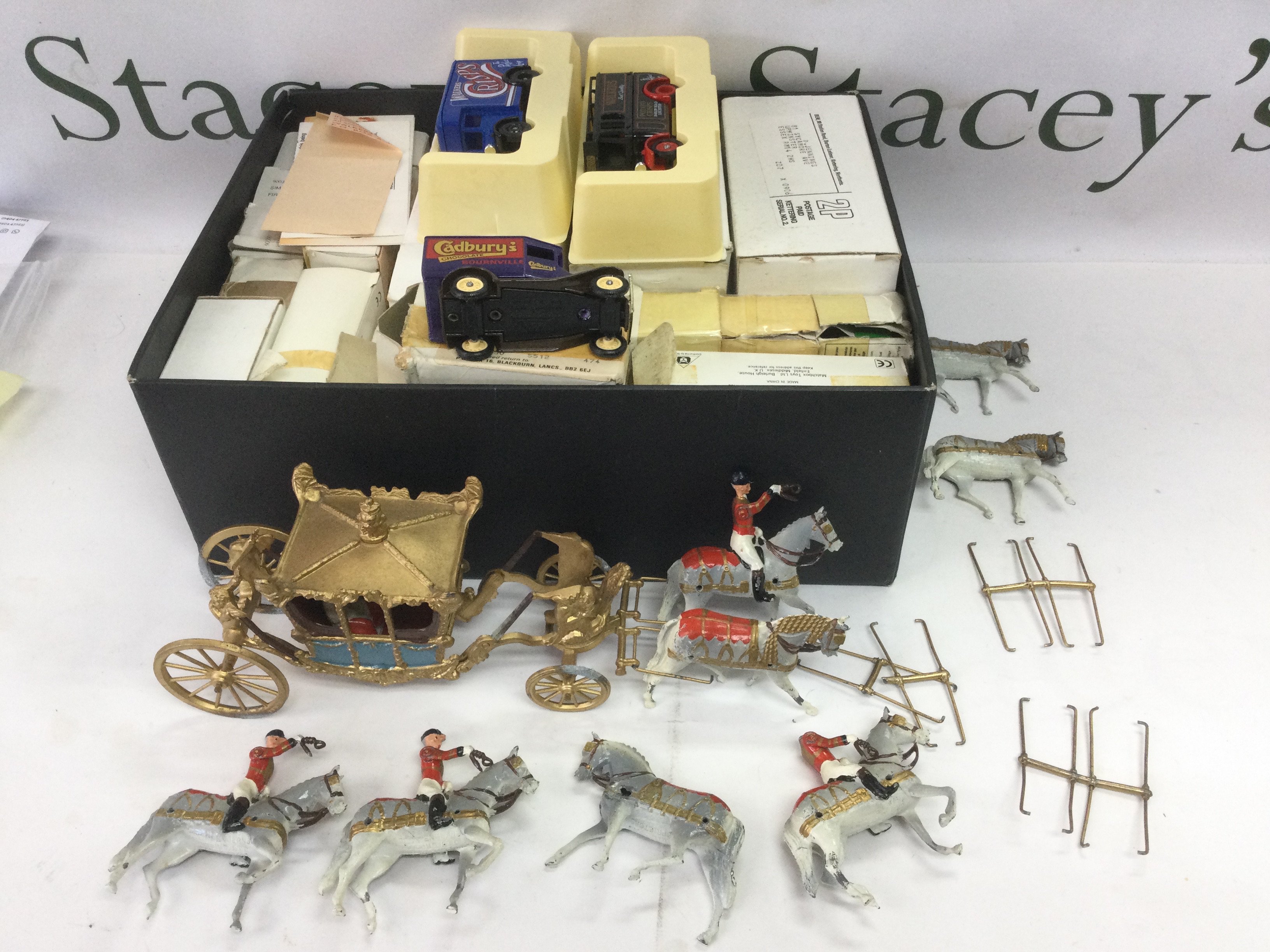 A Queen's Coronation coach and horses plus a collection of die cast vehicles. Shipping category B.