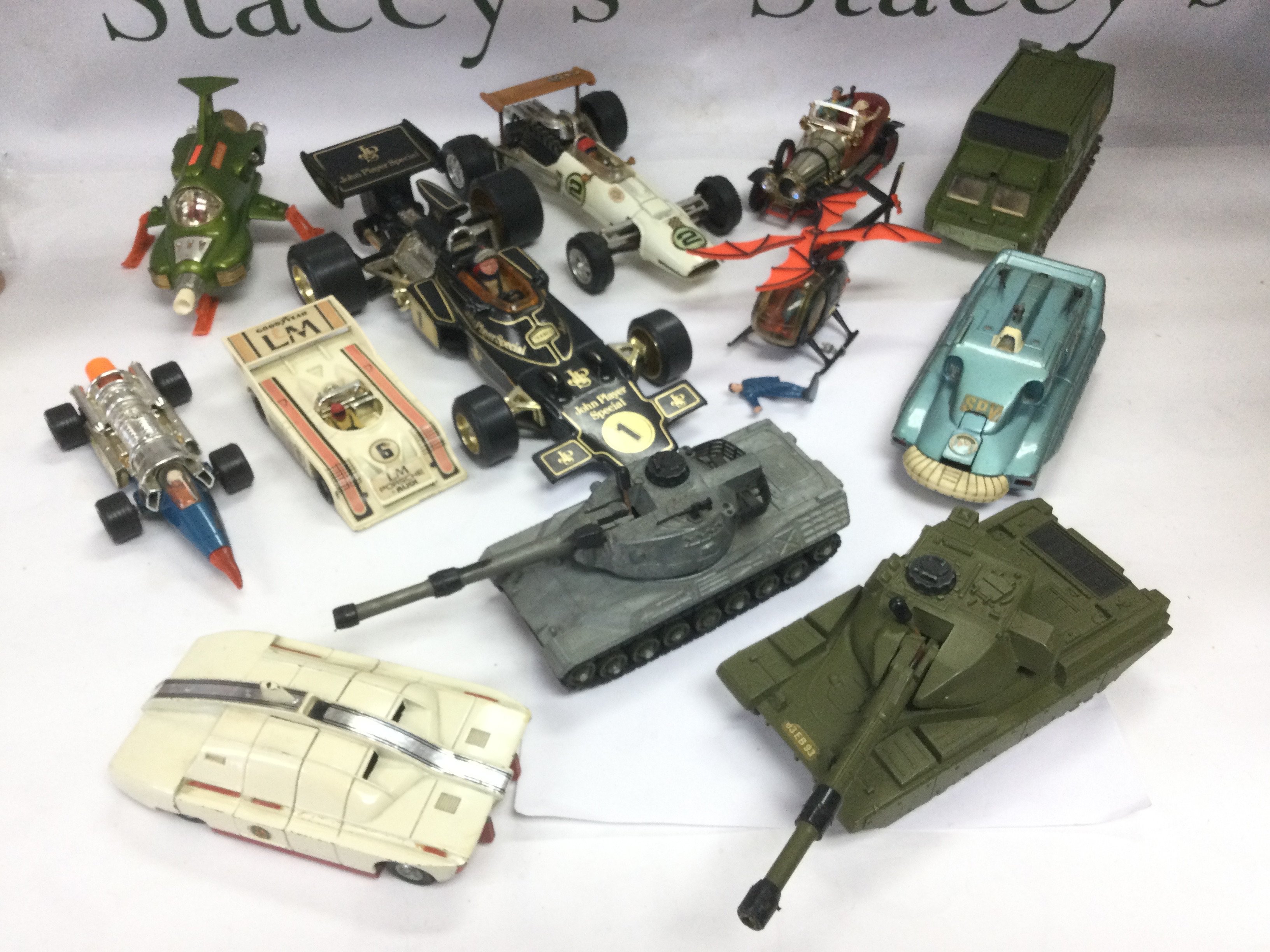 WITHDRAWN Four boxes of various playworn and boxed die cast vehicles including Chitty Chitty Bang Bang, Bat copter, UFO SHADO vehicles, tanks, F1 cars etc. Includes Corgi and Dinky examples. Shipping category D.