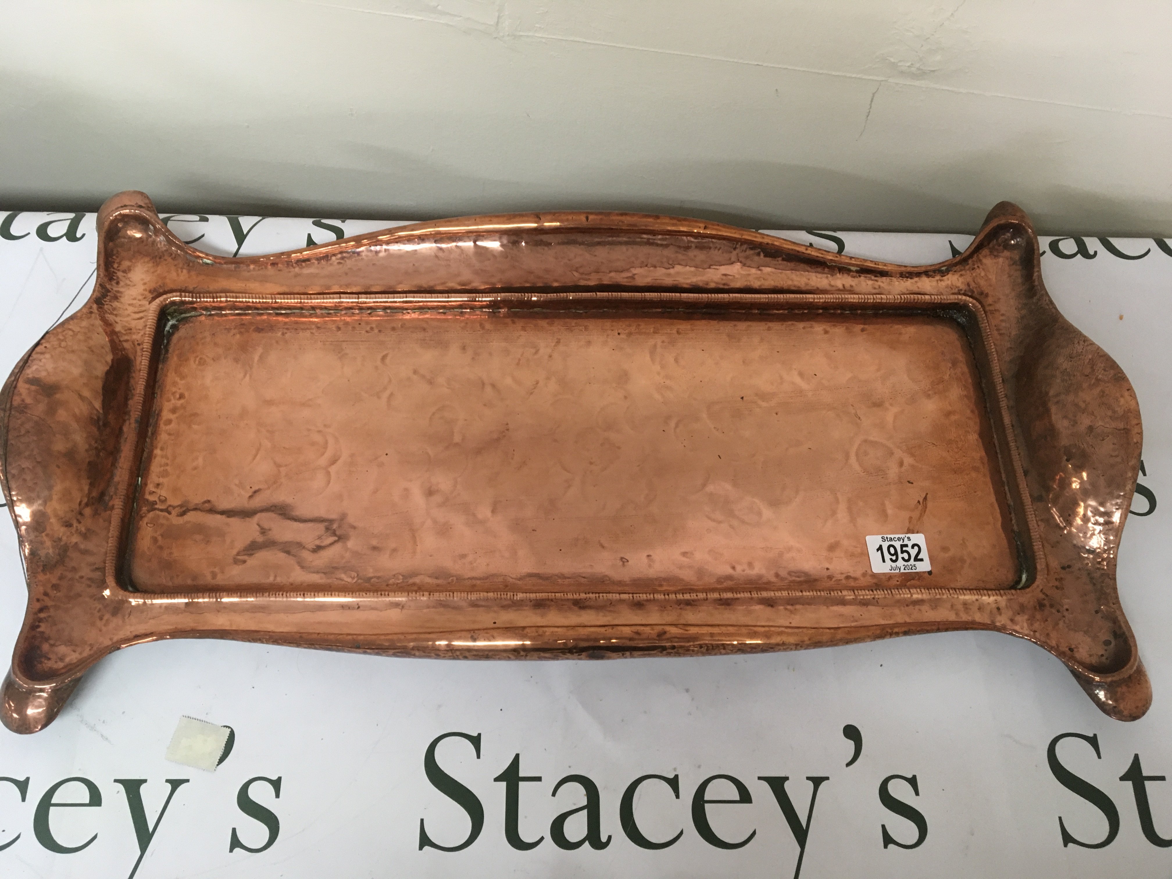 A Quality Art nouveau hand hammered copper tray of rectangular shape with raised sides and of rectangular shape. 66cmx 30cm
