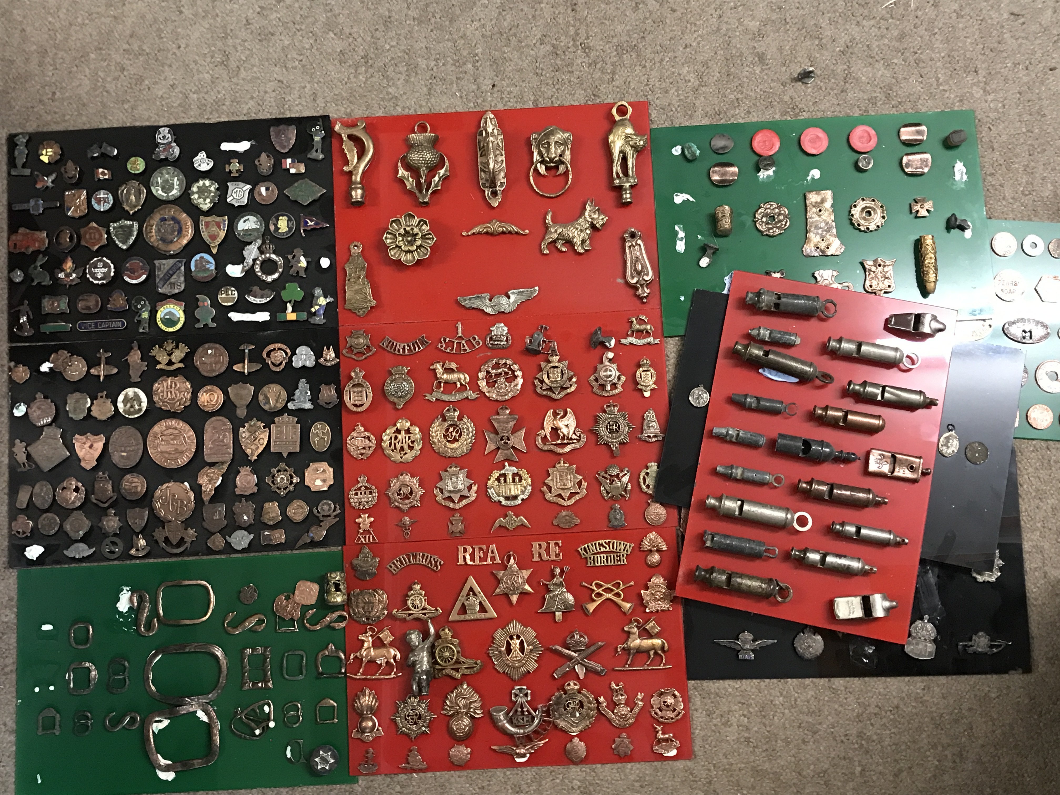 A Collection of various metal detector found items including tokens, cap badges, Saint Christopher pendants etc . Postage category C