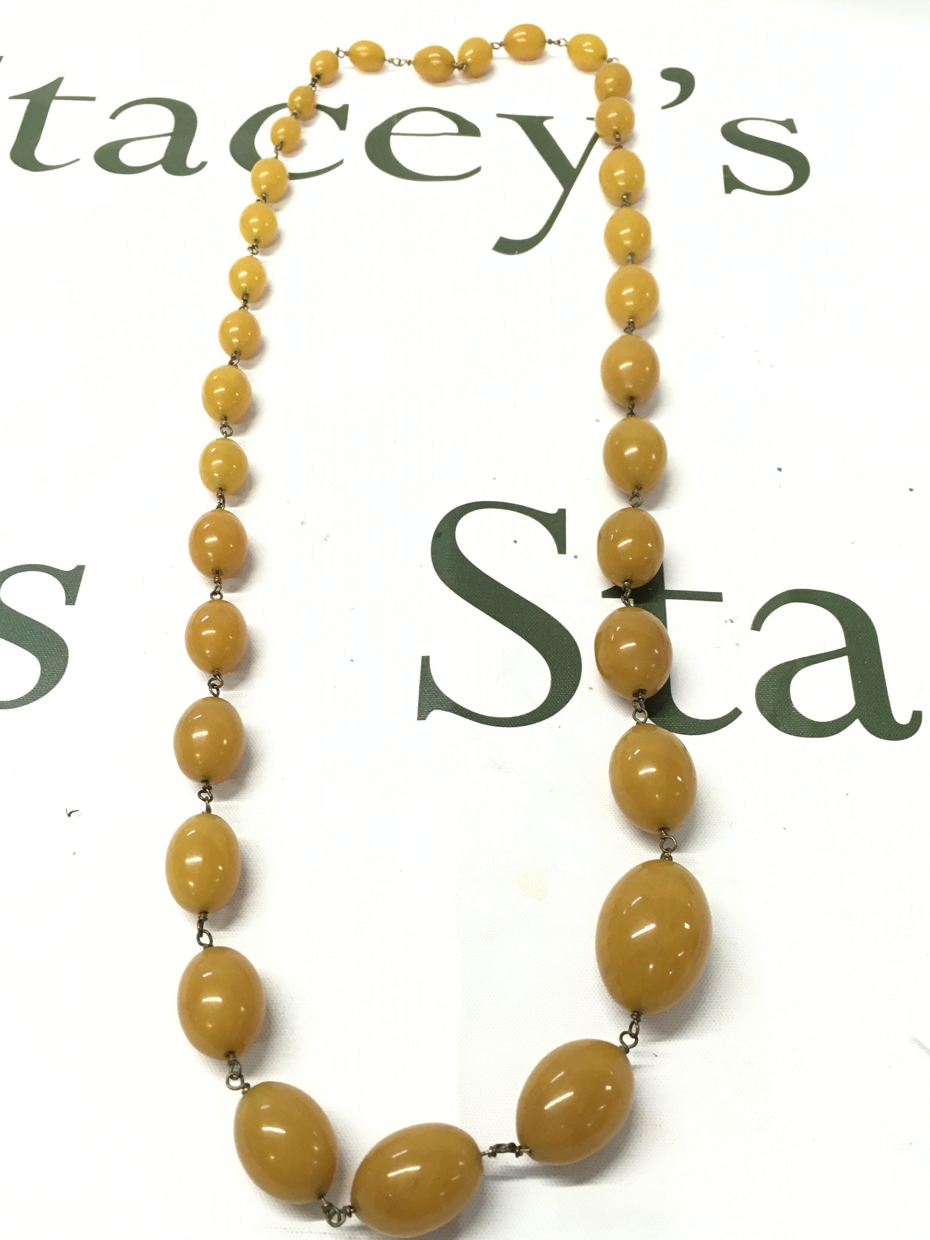 Bakelite and silver colour necklace , 84cm long. 95g total weight