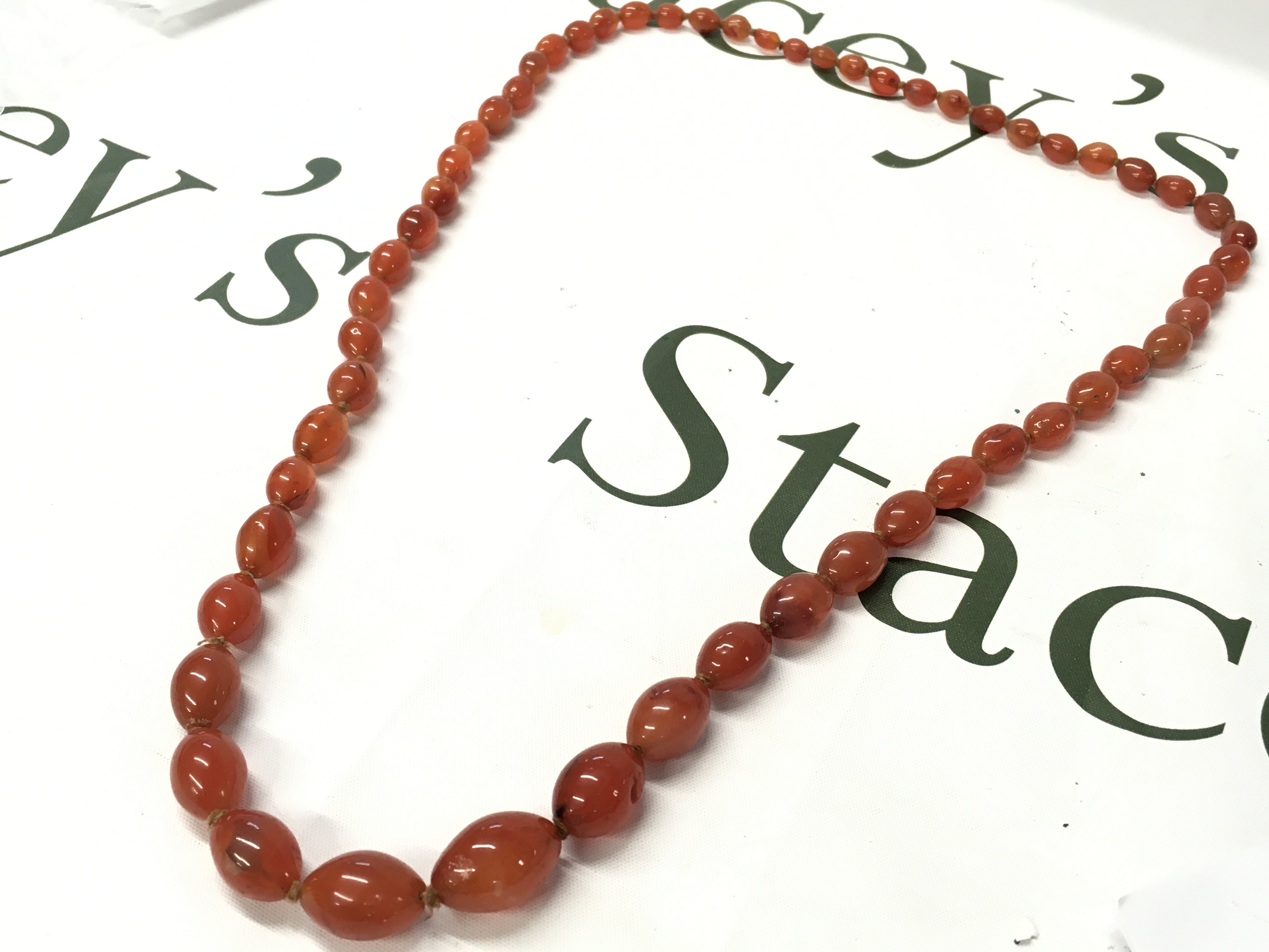 Graduated bakelite amber necklace , 85cm long. 115g total weight. Postage category A