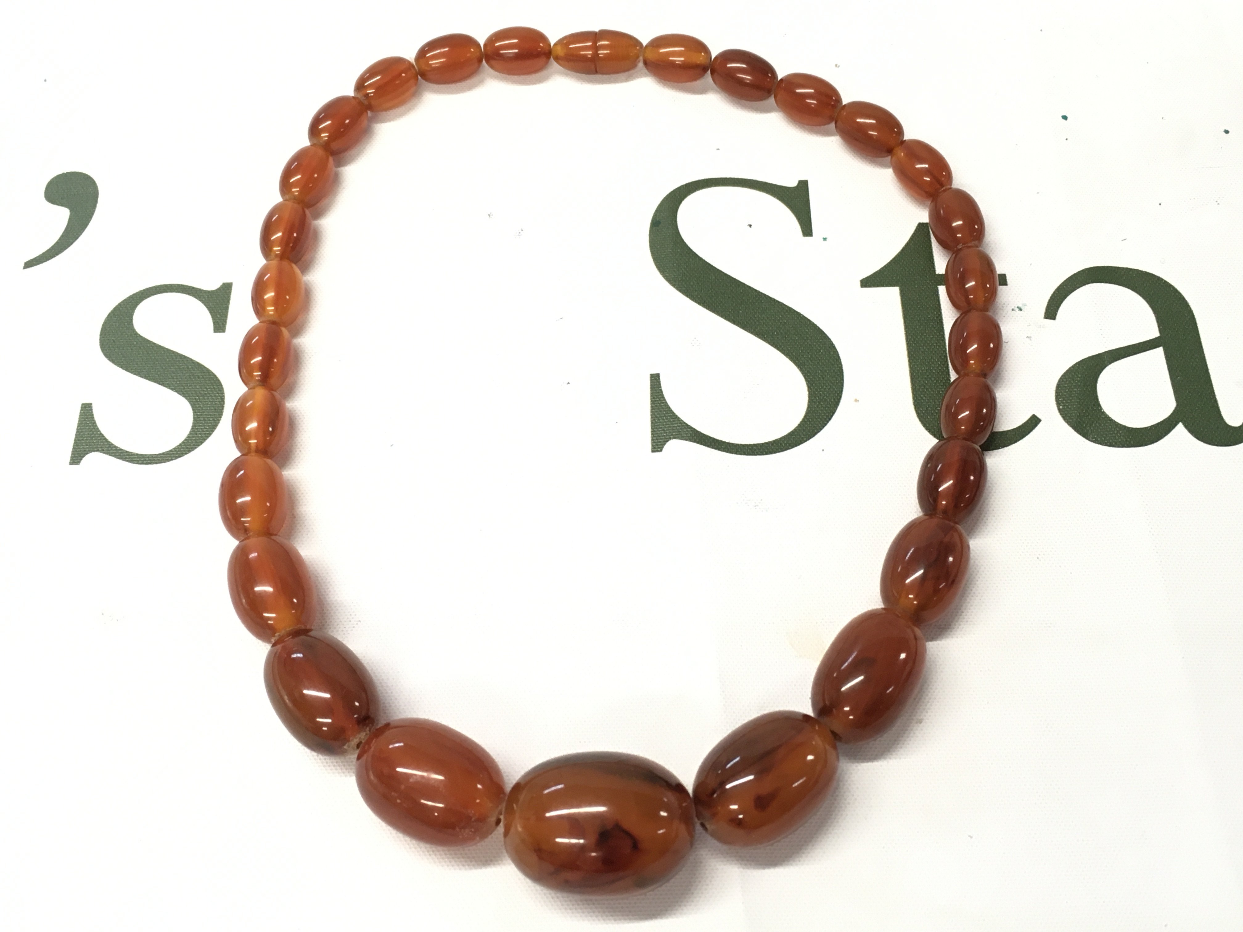 Bakelite amber necklace , 46cm and 58g approximate weight Postage category A