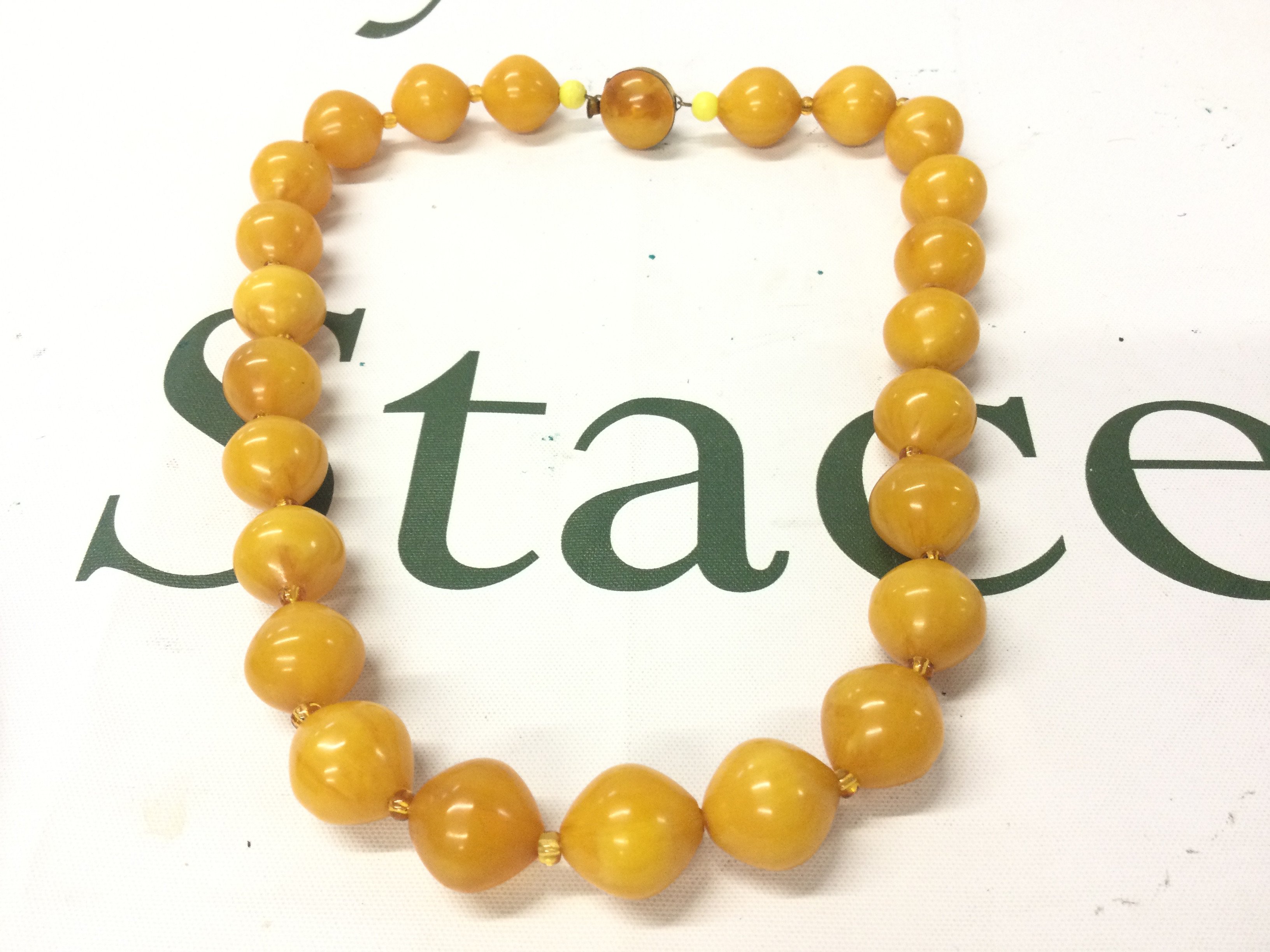 A butterscotch Bakelite amber necklace ,50cm long and 65g weight postage category A