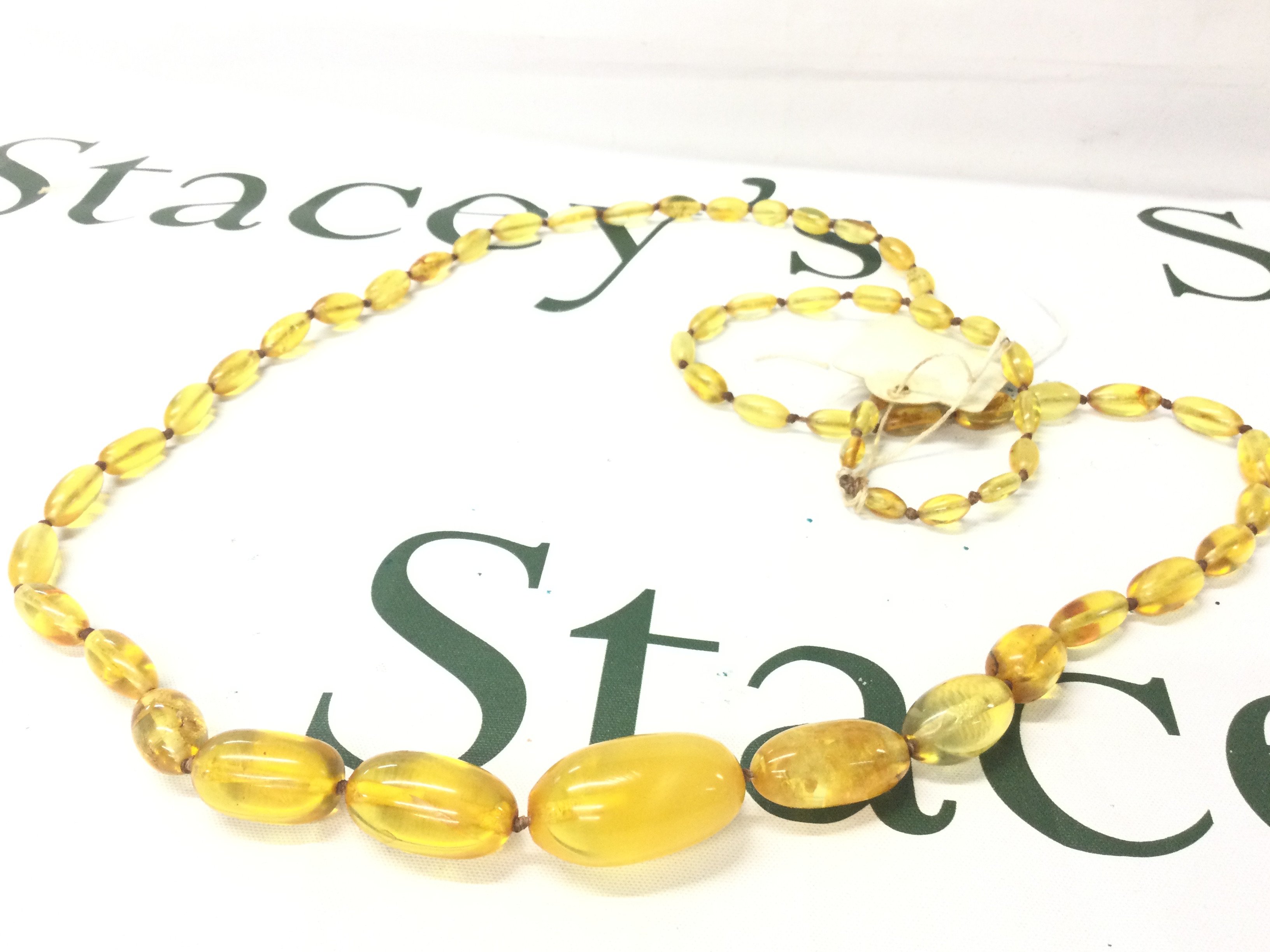 A Baltic amber necklace, 112cm 45g