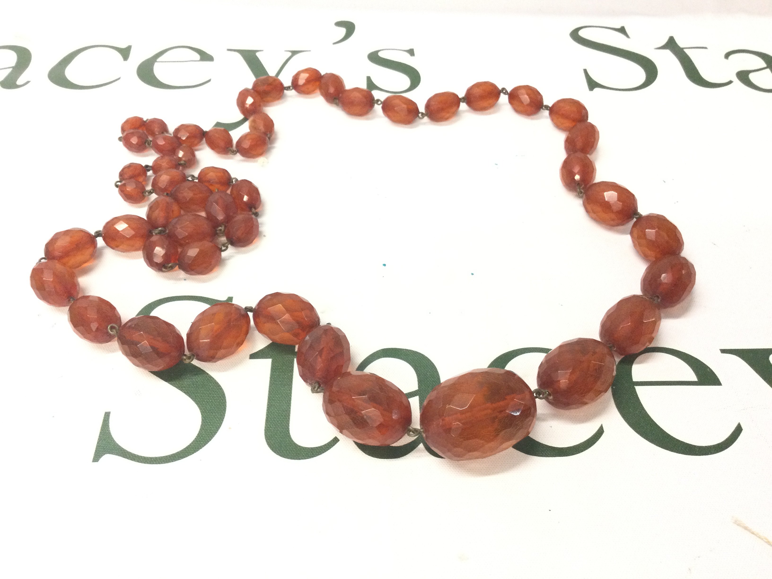 A Large Faceted Baltic Amber Necklace, 100cm 100g