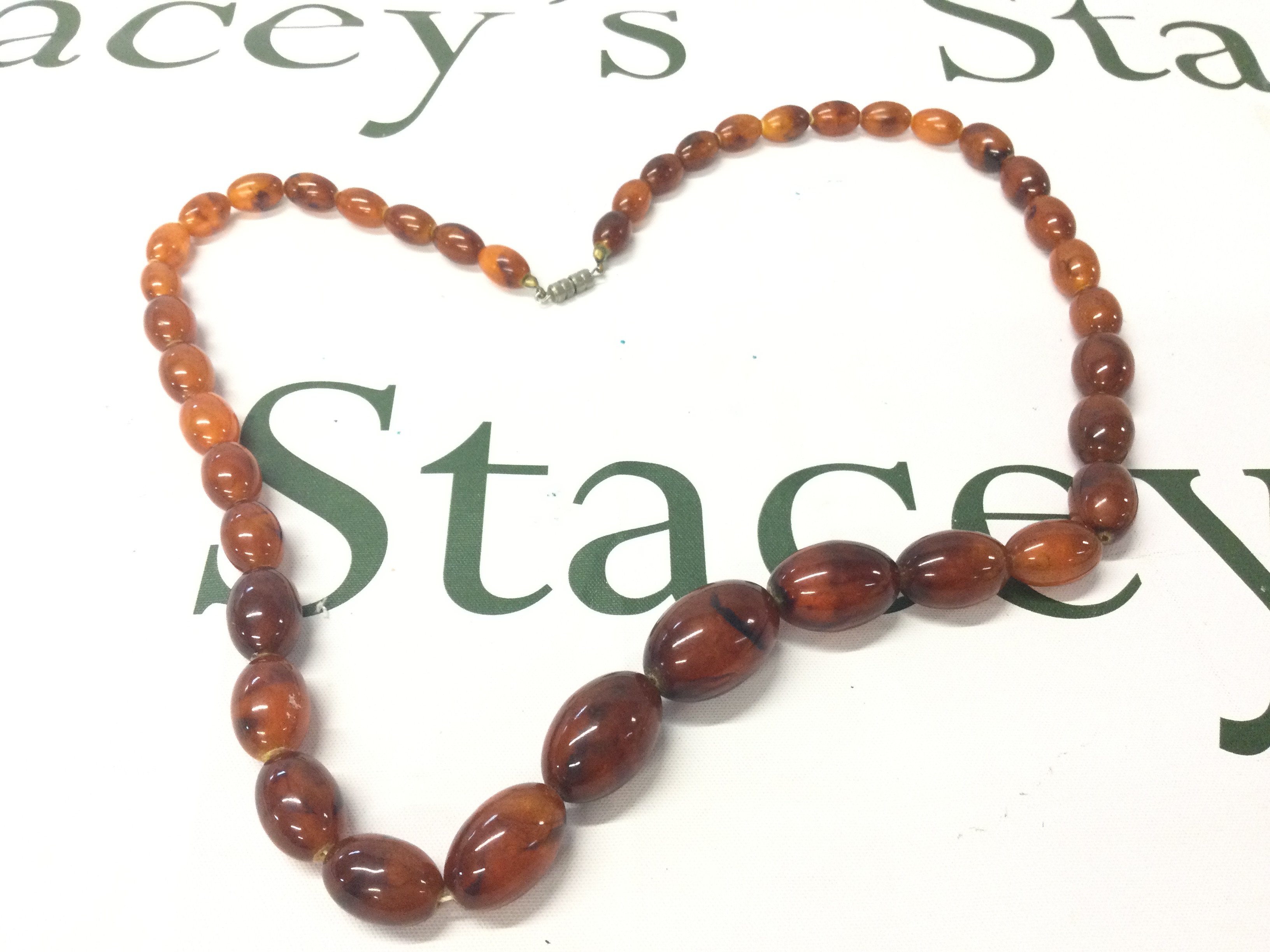 A Graduated Baltic Amber Necklace, 75cm 65g