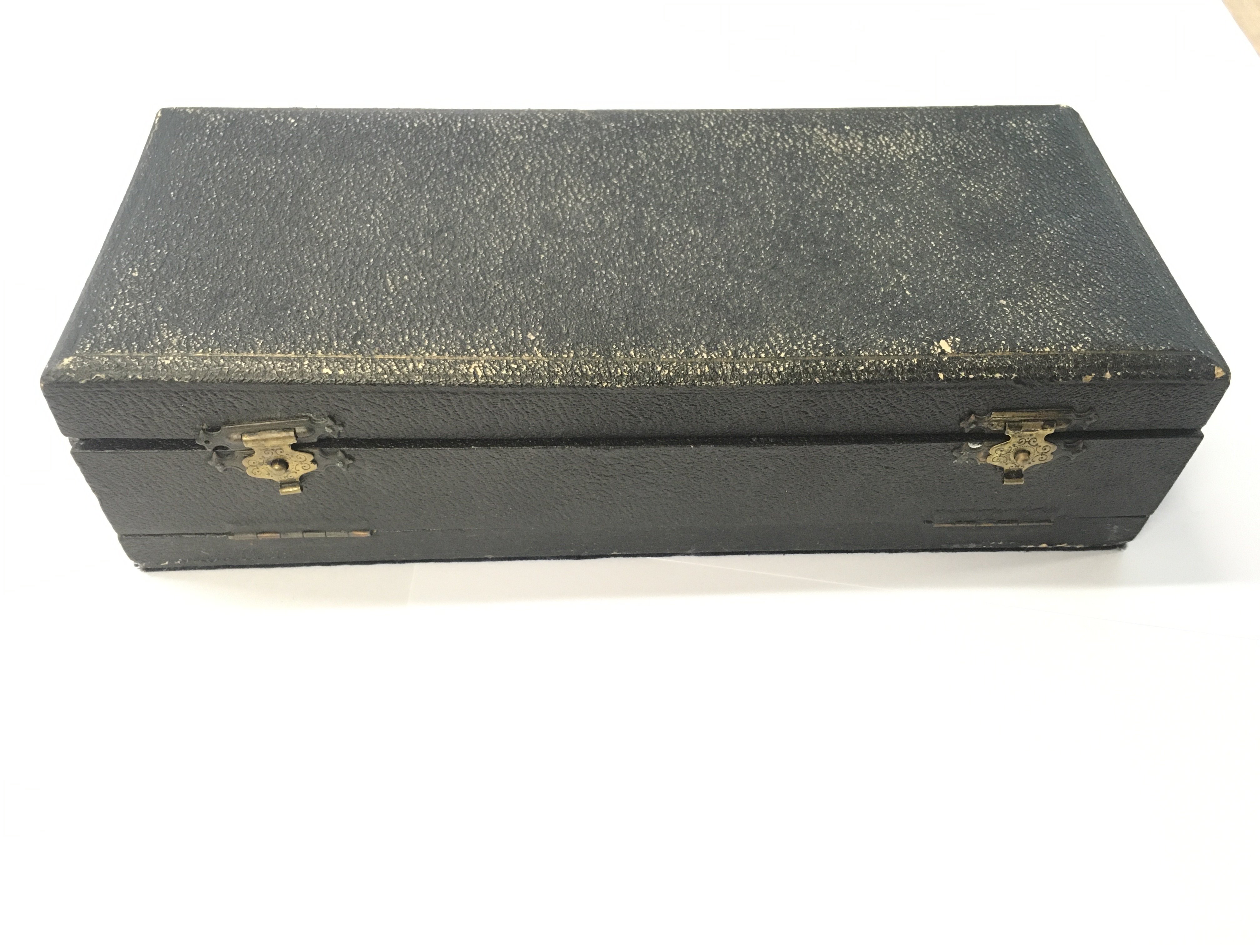 Leather boxed antique brass cribbage board and domino set.