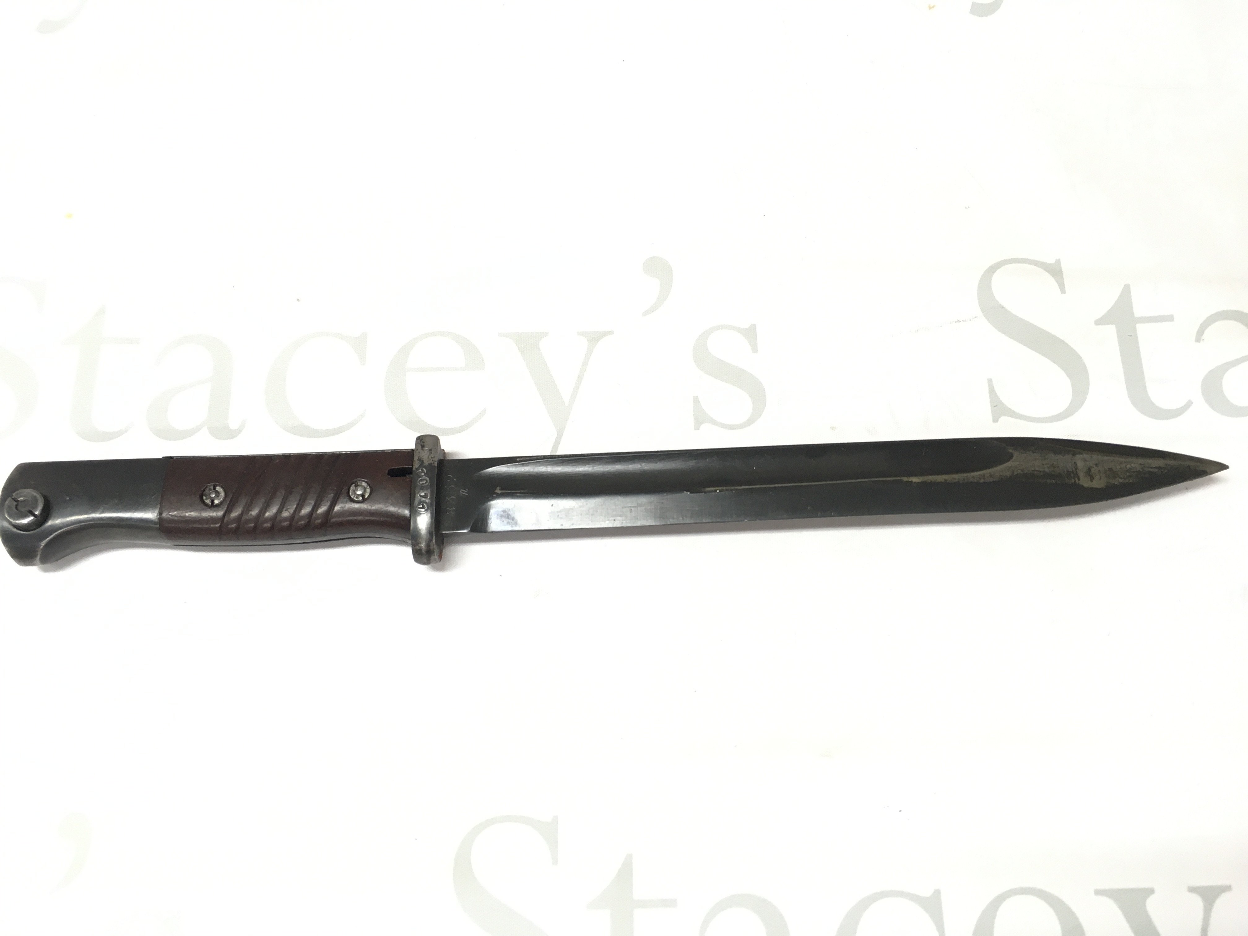 A WW2 German K98 bayonet with scabbard and frog. Frog marked Carl Ackva Bad Kreuznach 1939. blade 27.5cm long 41cm long total length.