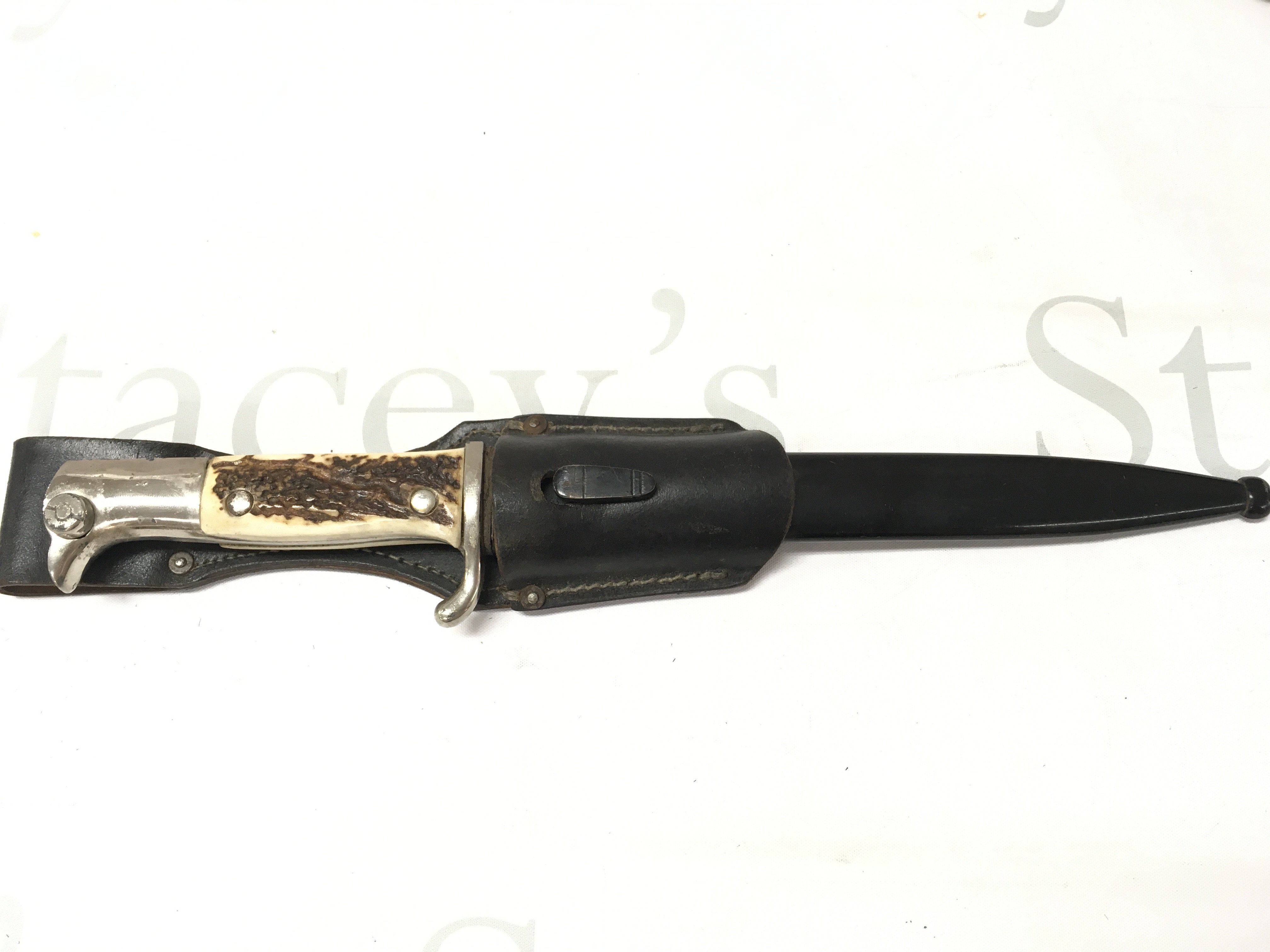 A WW2 Third Reich Dren Bayonet by E Pack & Sohne ,Solingen with stag horn grip and black leather frog . This lot cannot be posted