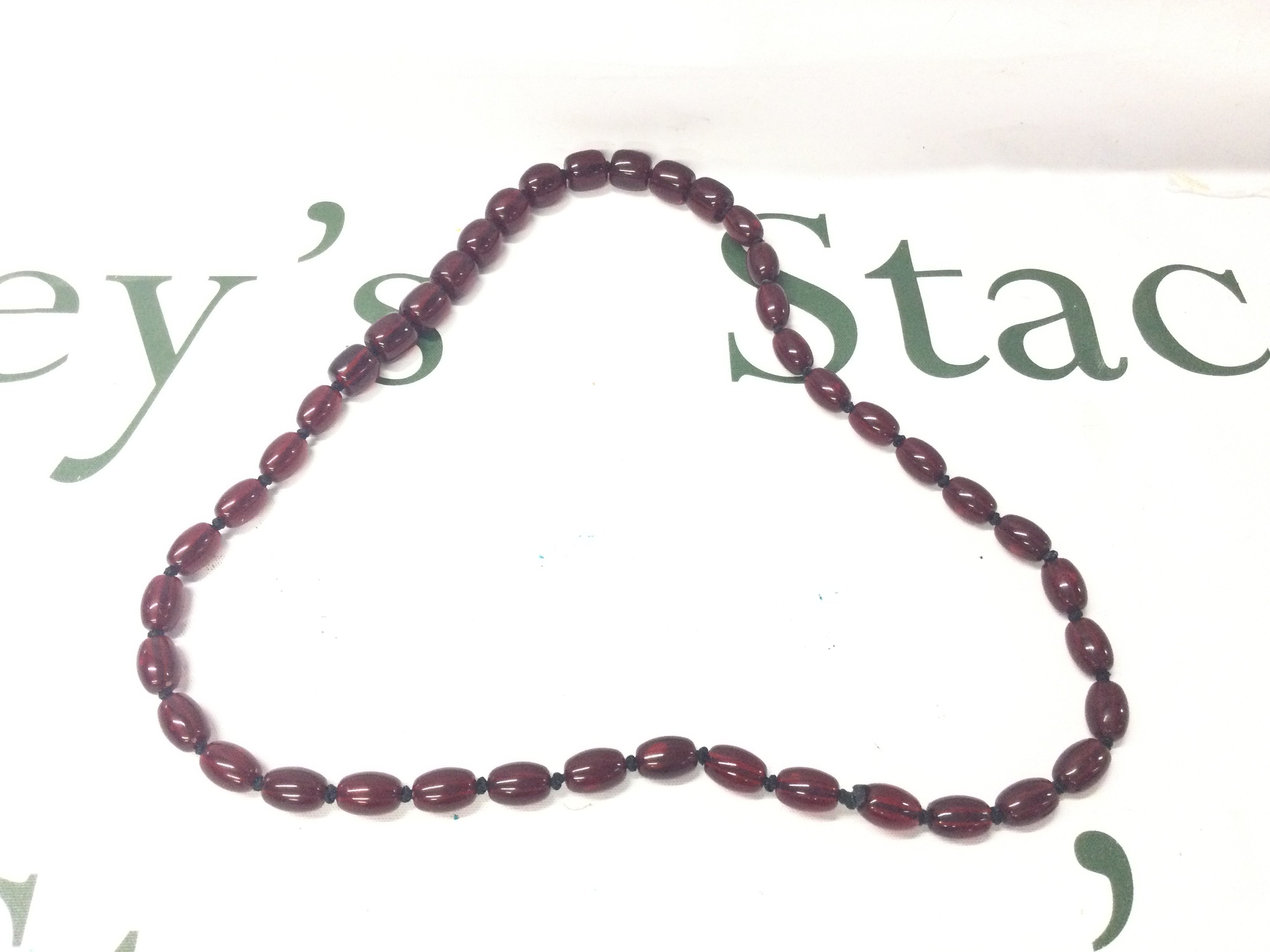 A Cherry Amber Bakelite Necklace, 66cm 40g