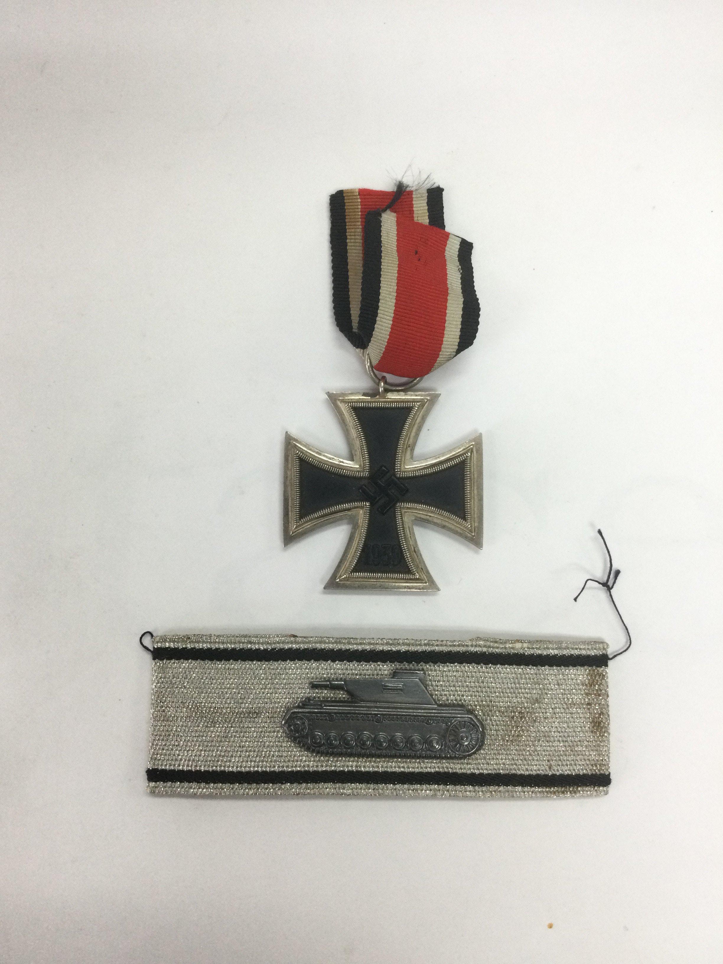 A WW2 German iron cross and a tank battalion badge (2). Shipping category A.
