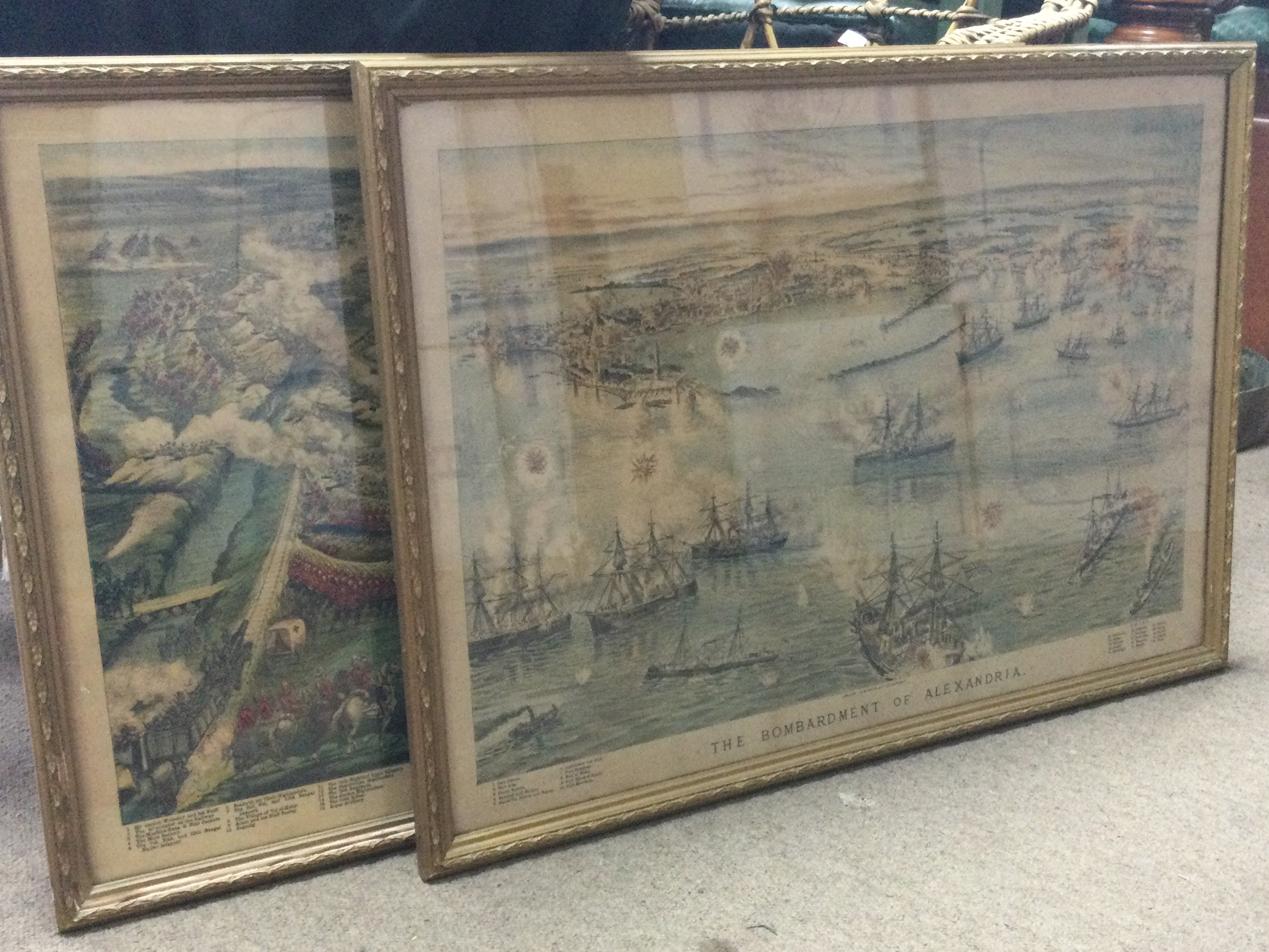 Two late 19th century framed military Lithographs , birds eye view of the battle of Tel- El- Kevin and the bombardment of Alexandria. Dimensions 79x58cm . This lot can be posted without their frames (cat B)
