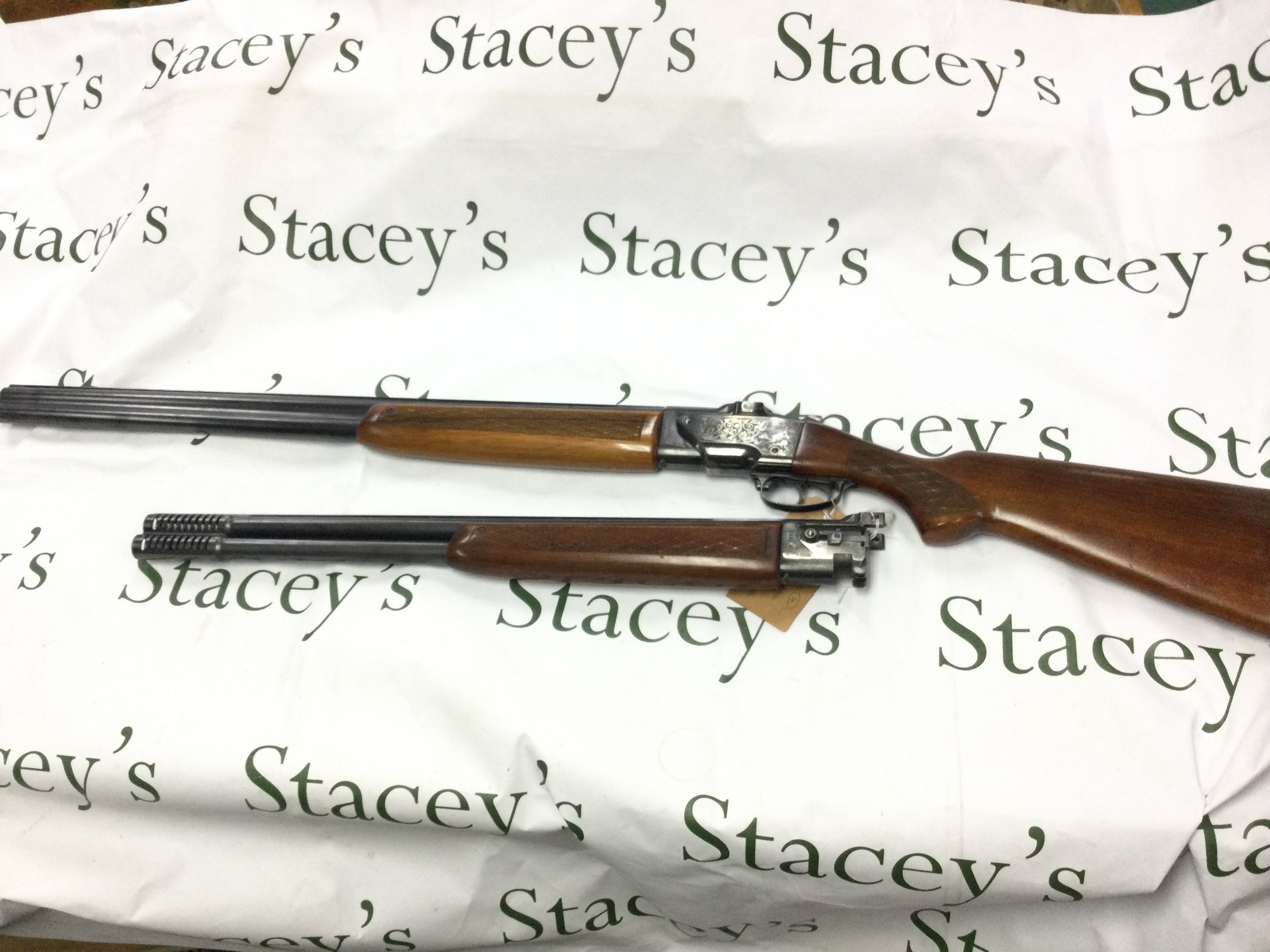 A 12 gauge over and under shotgun with walnut stock. Double trigger with ejector and fixed choke. Comes with spare barrel. BRNO model ZH303. Serial number 317773. PLEASE NOTE THAT A SHOTGUN LICENSE IS REQUIRED TO PURCHASE THIS ITEM. COLLECTION AND VIEWING BY APPOINTMENT ONLY.