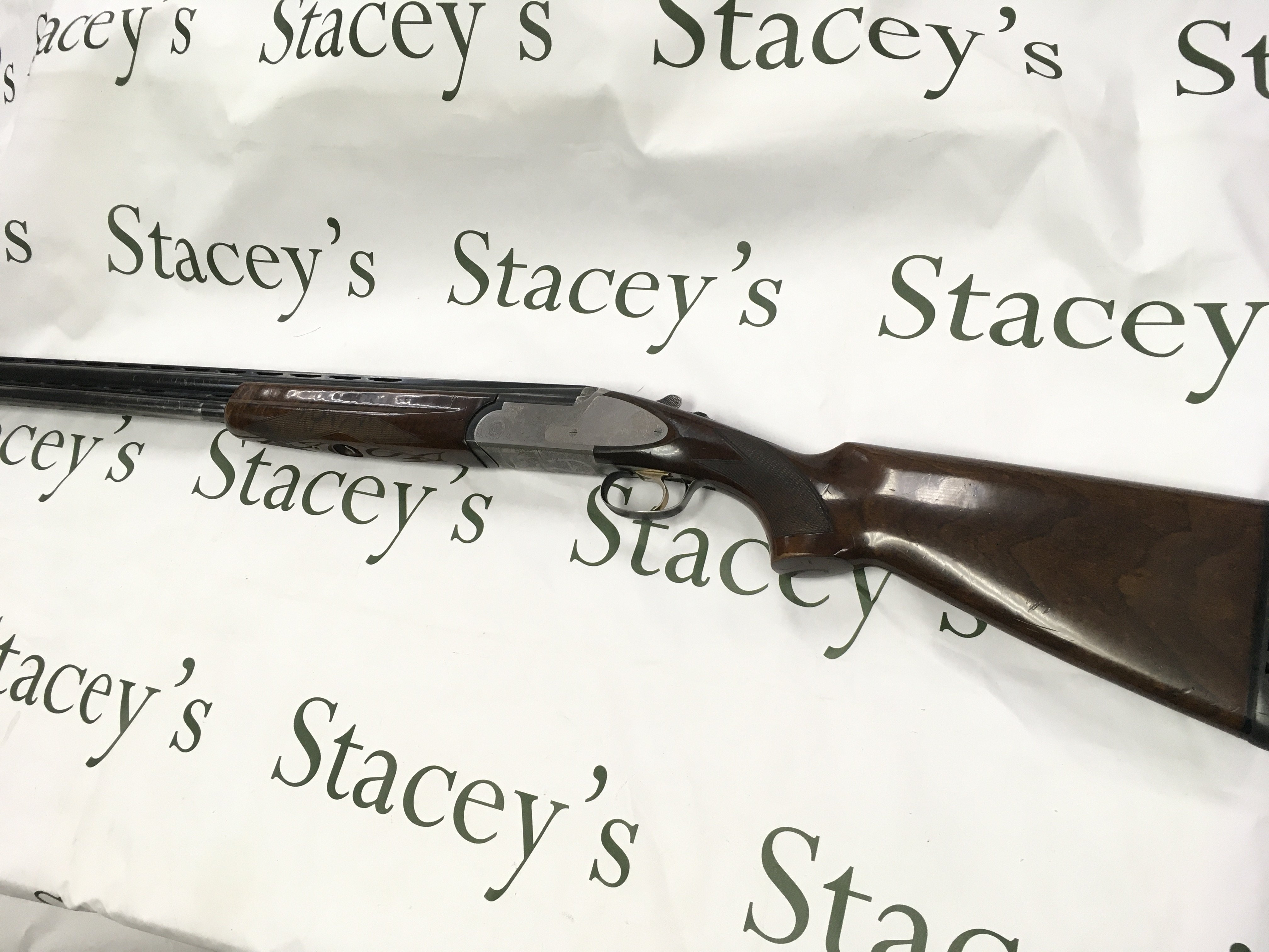 A Rizzini E 12 gauge side plate over under shotgun. Multi choke single trigger. 28inch barrel. Serial number 69967. PLEASE NOTE THAT A SHOTGUN LICENSE IS REQUIRED TO PURCHASE THIS ITEM. COLLECTION AND VIEWING BY APPOINTMENT ONLY.