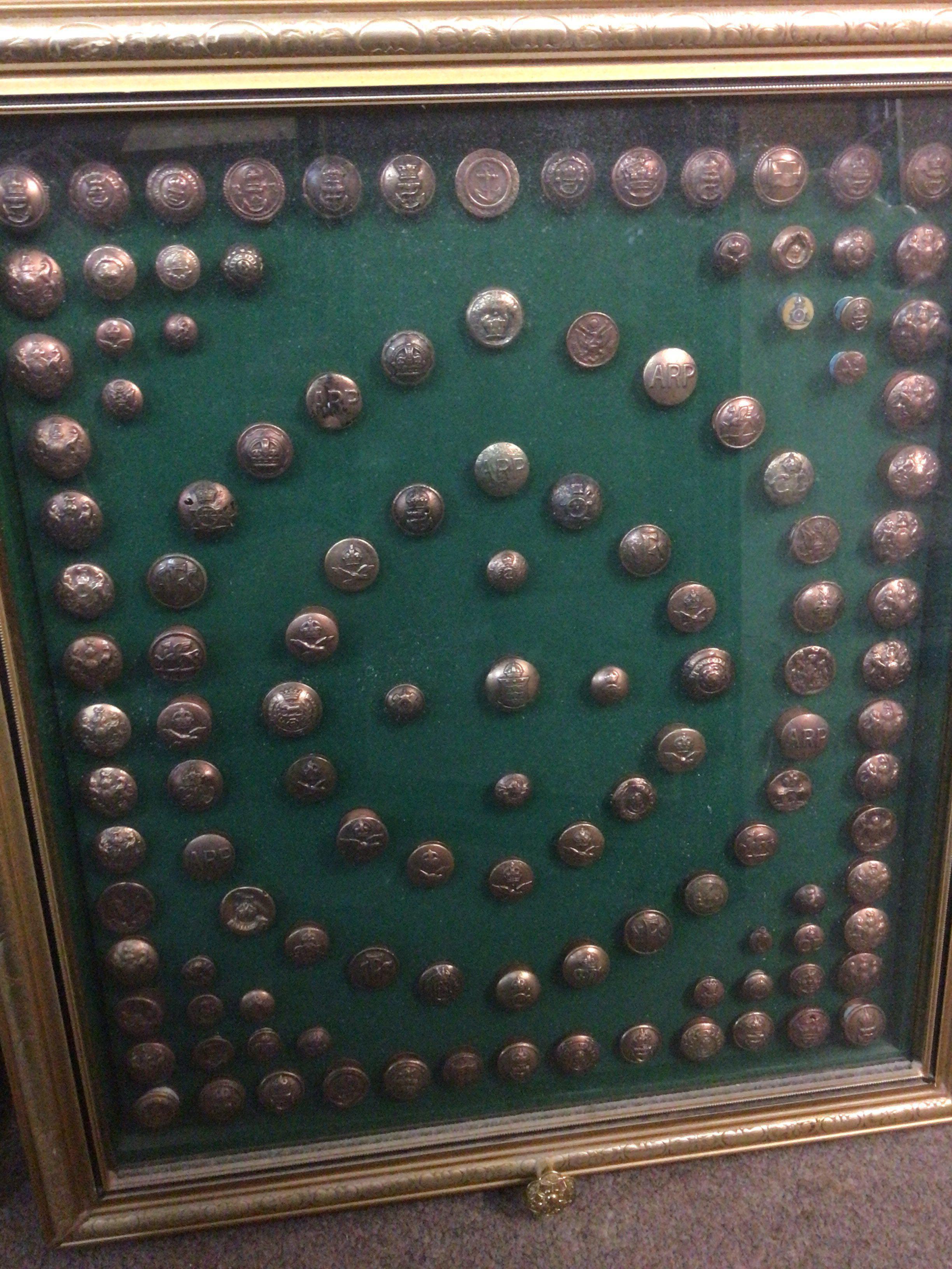 A case containing military buttons. This lot cannot be posted