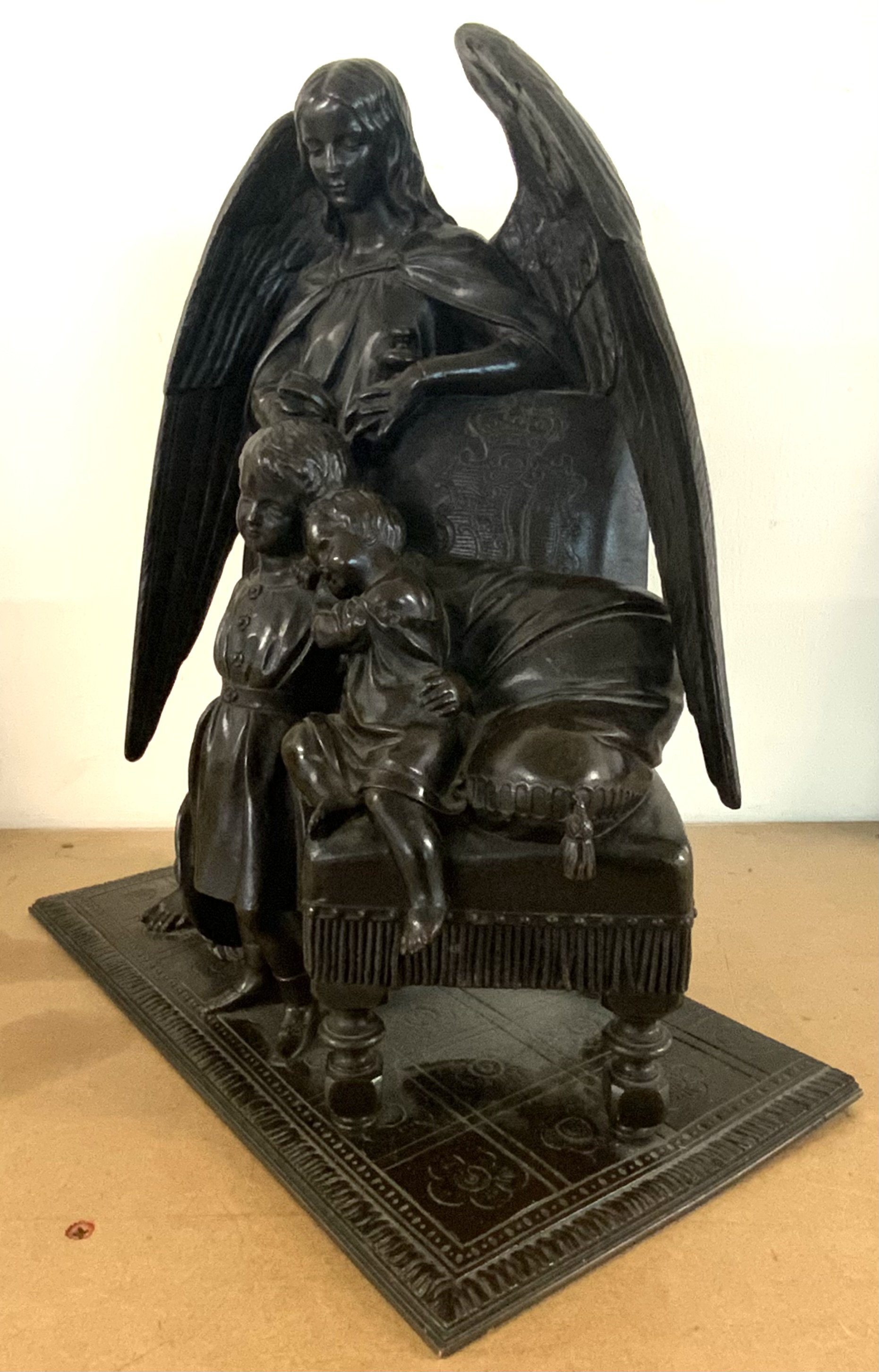 WITHDRAWN-A 19th Century cast bronze group figure depicting Angel Gabriel watching over 2 children. 34.5cm x 30cm x 17cm. (No foundry marks and artist marks visible)
