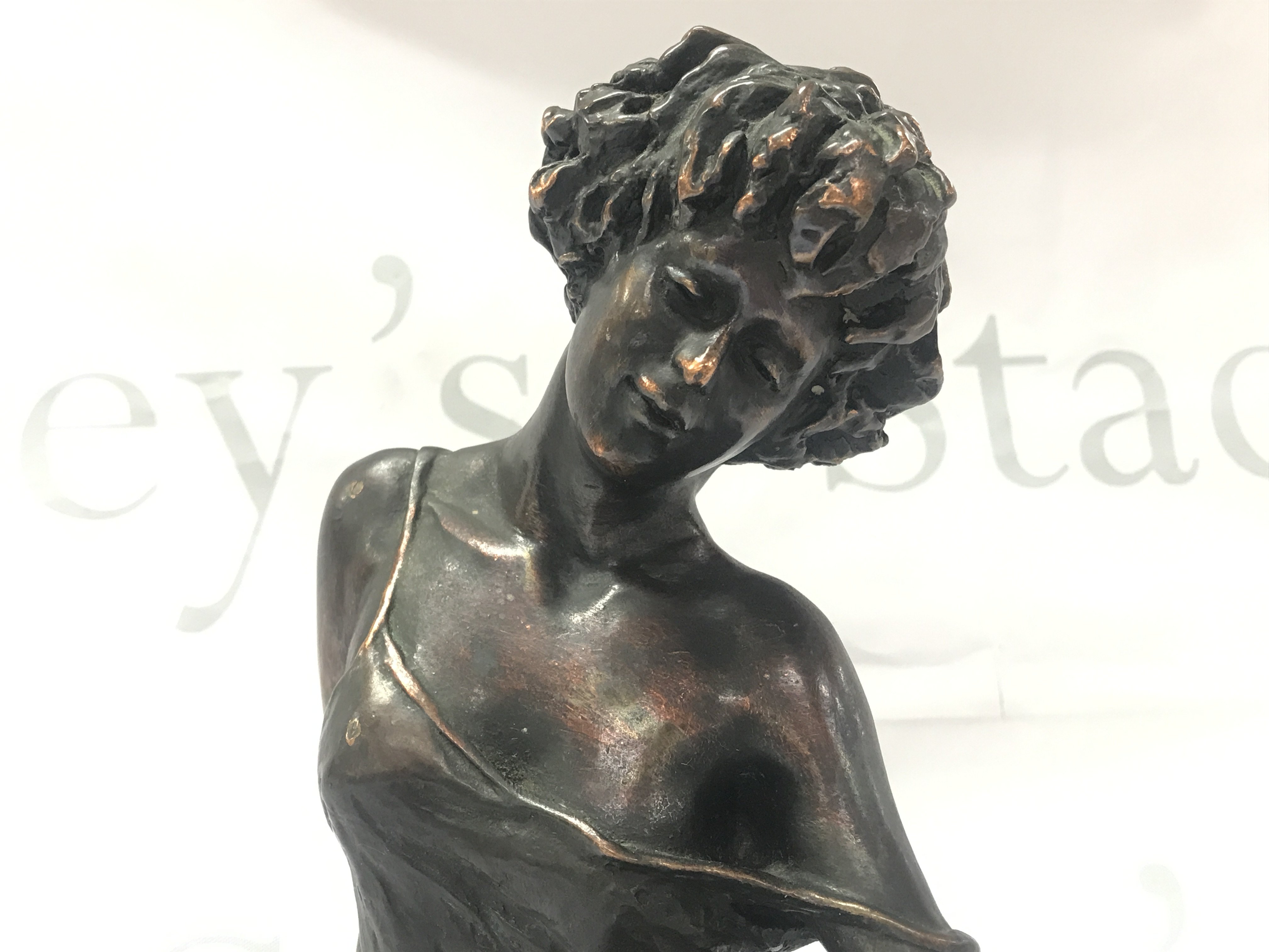 A cold composition bronze classical figure of a seated woman , signed .24cm tall. Postage category B. NO RESERVE