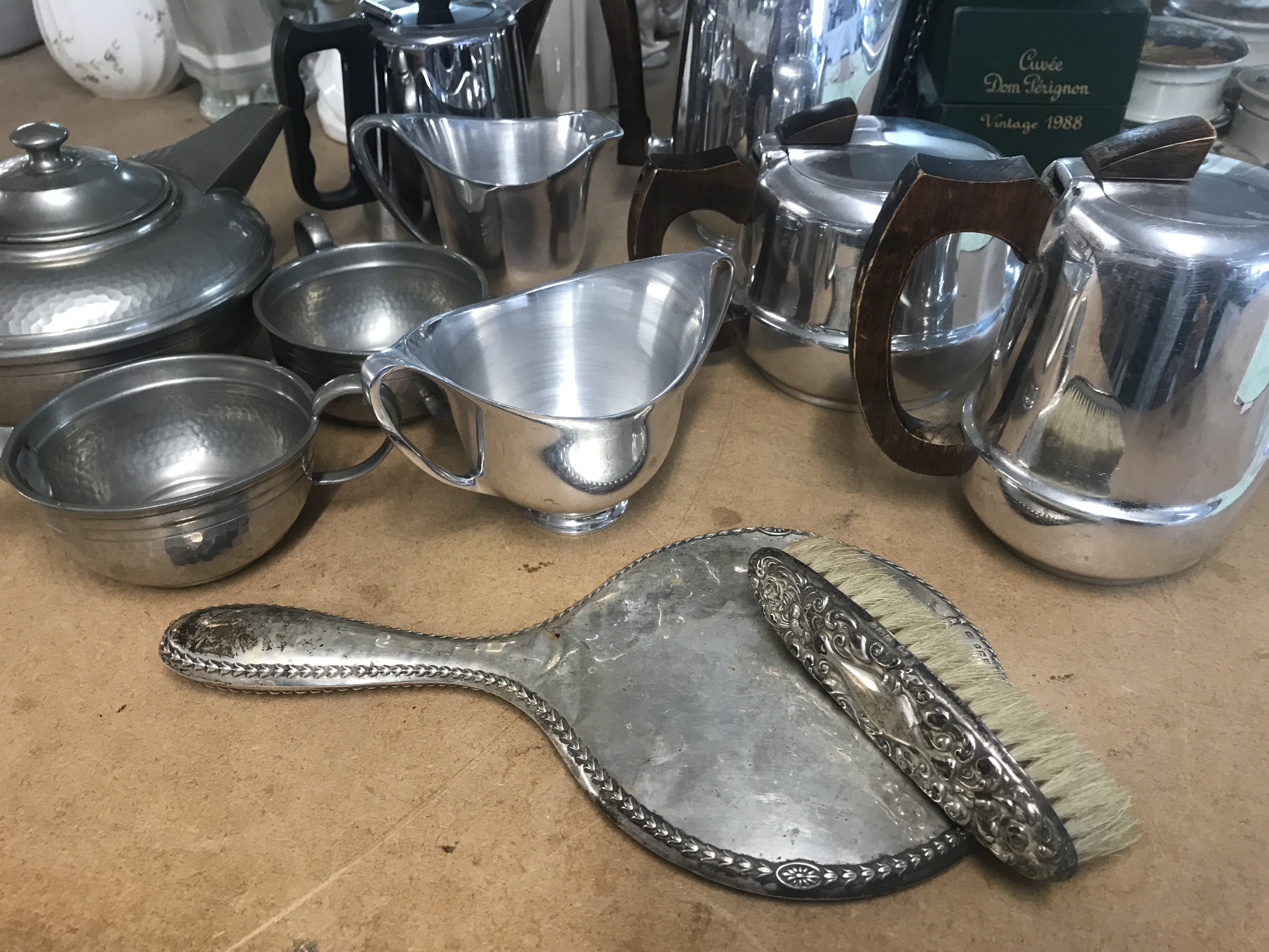 Three tea sets including pewter and picquet ware . Hand mirror and brush. NO RESERVE