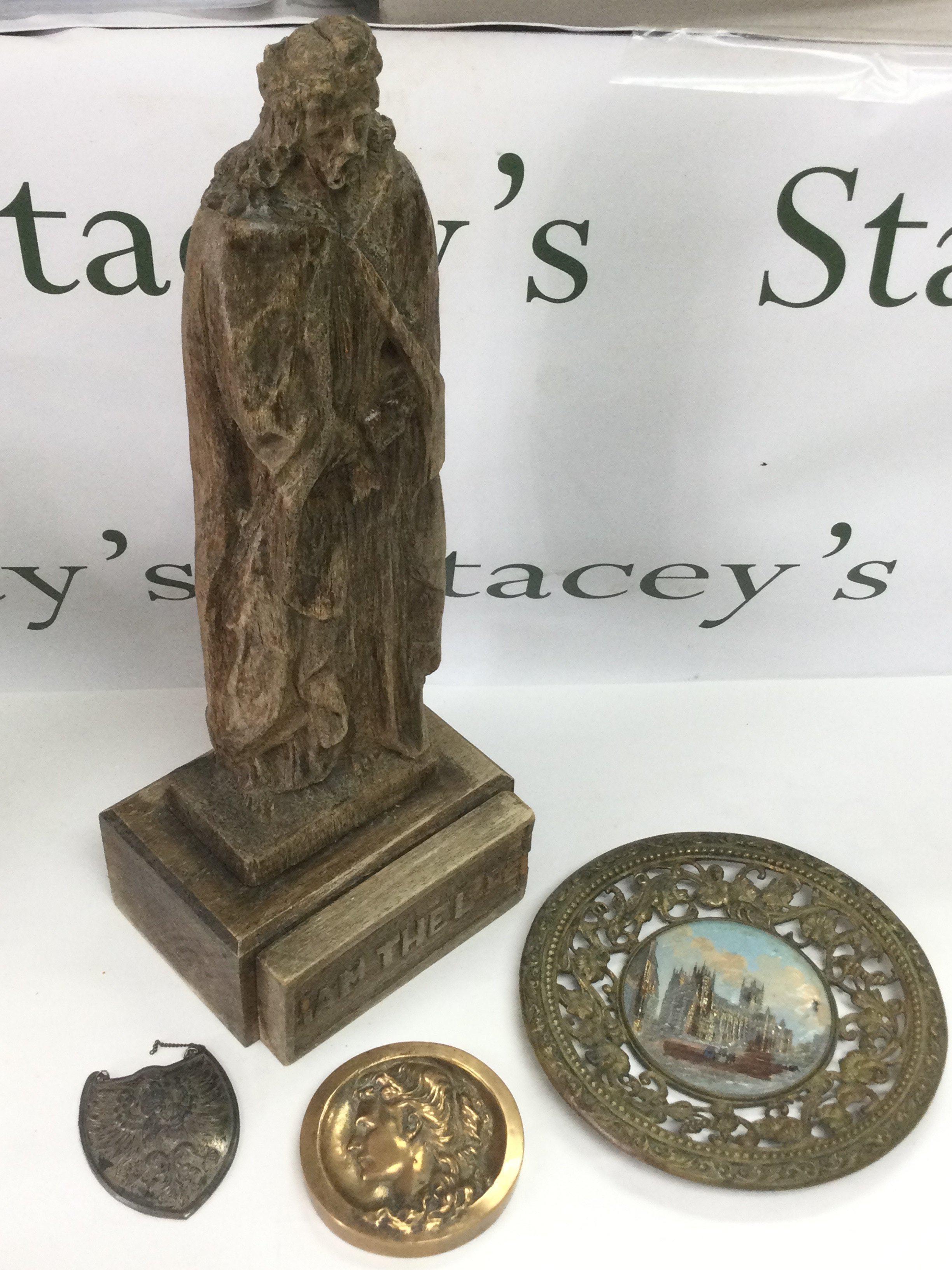 A carved wooden figure of Jesus Christ, a bronze circular plaque of a lady in profile etc. Shipping category D.
